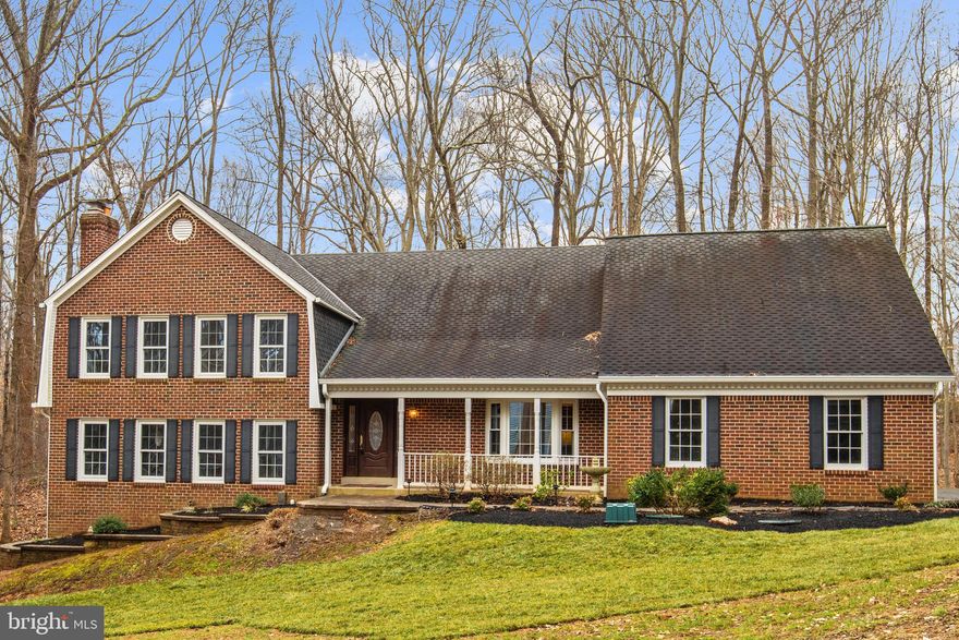 A nod to the classics in this stately home set on wooded acre in established Brecon Ridge Woods. Close to all NOVA points, with premium privacy. Spacious Interior nicely updated and with a seemingly endless amount of finished space! Noteworthy-sized Bedrooms (like they use to be!) Amazing Master Suite has separate Sitting Room PLUS HIS/HER Baths - one with soaking tub and one with step-in shower. Modernized Kitchen full of quality stainless appliances, ample cabinetry and big Breakfast area set in bay picture window. Full-length tiered Sun Deck lets you take the Party Outside! Family Room & Recreation Room both feature a gas brick fireplace AND pub-style wet bar where all can "belly up"! To top it off, how about the 4-CAR ATTACHED GARAGE!