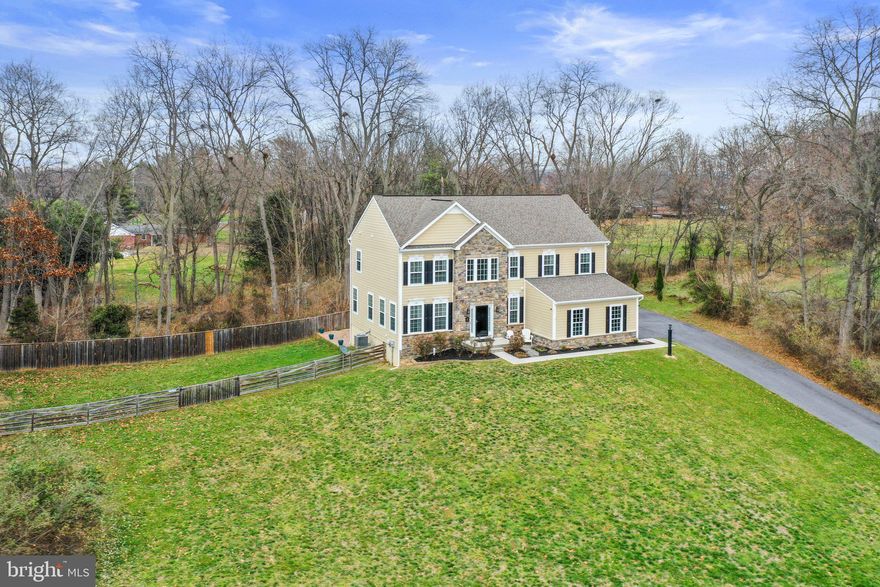 Welcome to 265 McQuilkin Run Way, a stately home nestled back into the trees with a beautiful front lawn (the lavender landscaping bed by the road catches your eye immediately!). Sitting on 2.44 acres, this large colonial is on a quiet street in the desirable Shepherdstown neighborhood of The Point. The home is only 8 years old and has been well-maintained by thoughtful owners. Large fenced yard (wood & wire for keeping in smaller pets). Walk through the front door into the sun-filled, two story foyer entryway. The main level features beautiful hardwood flooring and a gourmet kitchen with granite countertops and stainless appliances. Walk out onto the trex deck where you'll find lots of space to entertain and host! Upstairs, you'll find four bedrooms, including three with walk-in closets. The basement has a 3 piece bath rough in--you can finish the basement or use for storage! Plenty of parking with the two car attached garage, expanded parking pad, and long paved driveway. Recent improvements: 30x14 trex deck (2017), stamped concrete patio (2022), stainless kitchen appliances (2020), and water softener/filtration system (2017). Close to historic Shepherdstown and commuter routes. Schedule your showing today!