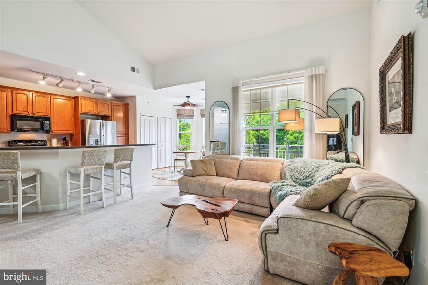 Welcome to this stunning 2BR/2BA Loft Condo in the highly desirable 55+ community of Four Seasons at St. Margarets!  Bright and beautifully updated, this model unit features soaring vaulted ceilings, fresh paint throughout, new lighting fixtures and ceiling fans, and a refrigerator less than a year old.  The gourmet kitchen boasts Corian countertops, top-tier cabinetry, and a cozy eat-in area.  Enjoy the open layout with a spacious living room and a dramatic spiral staircase leading to a versatile loft—ideal for a home office, reading nook, or TV lounge.
The primary suite includes a large walk-in closet and an elegant en-suite bath with double sinks and a walk-in shower.  The second full bath features a jetted Jacuzzi tub and a bidet toilet. You'll also appreciate the full-size washer and dryer, generous linen closet, and additional storage.
Located just steps from the elevator, this unit offers convenience and comfort.  The meticulously maintained building and community provide resort-style amenities including a clubhouse, pool, fitness center, card and billiards rooms, and a party room with a full kitchen.  All this, just minutes from downtown Annapolis and the Eastern Shore—come experience the lifestyle you deserve!