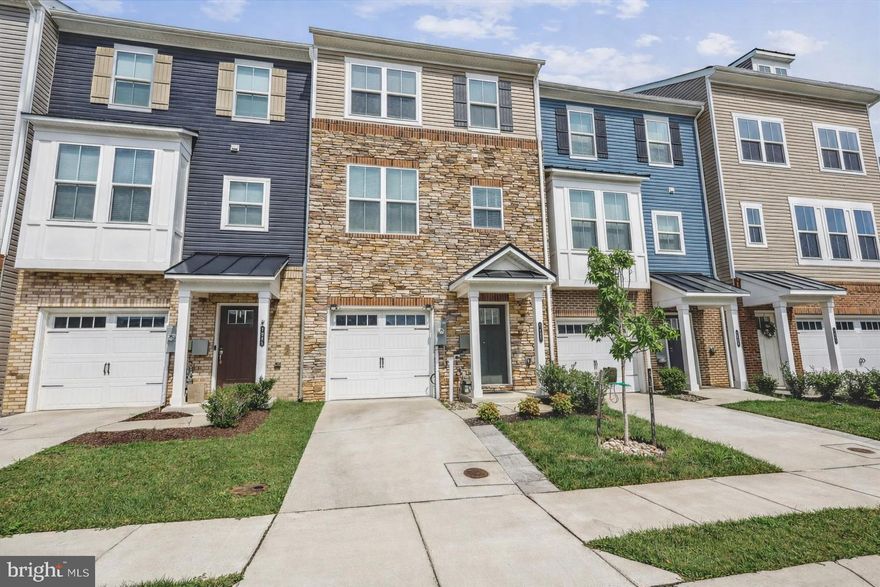 Motivated Sellers and Value Priced.  All reasonable offers considered.  Discover this Quality Built like-new townhouse located in The Ridges, a sought-after community in Hanover. This home is move-in ready with modern finishes. You'll love all of the upgrades such as hardwood floors, custom paint, and chic decorative finishes for comfortable living and entertaining. The main living area features hardwood floors, a bright and spacious living area, and an upgraded kitchen package with quartz countertops, breakfast bar, custom backsplash and lighting, a center island, stainless steel appliances, and ample cabinet and pantry space. The dining area flows seamlessly onto a PRIVATE East facing 16' x 8' deck, perfect for morning coffee or evening relaxation. The additional living space on the entry level has a spacious foyer and family room, hardwood floors, storage, and walkout access to a fully FENCED backyard - ideal for pets, gardening, or hosting summer gatherings! Upstairs, the primary suite has a walk-in closet and an en-suite bath with a double sink quartz vanity, and tiled shower. Additional generously sized bedrooms have plenty of natural light and storage. Enjoy the convenience of a one-car garage and private driveway for easy parking. Don't miss this rare opportunity for a large, light-filled townhouse with PREMIUM features. Conveniently located near commuter routes, shopping, and dining. Quick turn around on short-sale approval.