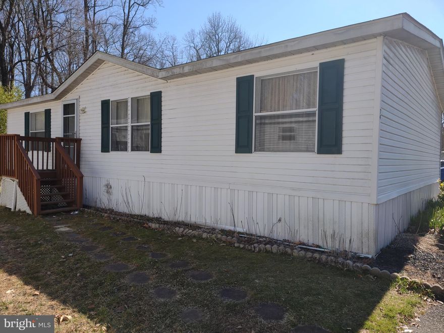 Beautiful  3 bedroom 2 bath with an amazing est. 1150 total  Square Feet. Lots of room to spread out . This double wide  home comes with a 2 year new roof w/ 25 year warranty. Brand new hot water heater, immaculately  kept with  updates and special treatments through out the house.  Owner will leave both pantry sets in kitchen for your extra space.. Table space for a eat in kitchen, clear skylight in bathroom, breakfast counter for bar stools, double pain windows , shed,  A lot of house for an AFFORDABLE PRICE  You wont find a nicer home . Park approval required.  lot rent 590.00 monthly . Pictures don't do this home  justice , make an appointment to see, and decide for your self what a steal you will get. Yard has  flower garden with lovely Spring flowers when in bloom.