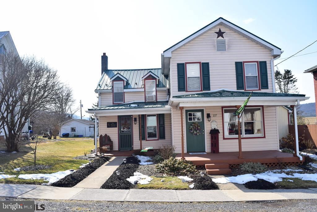 Atmosphere to charm you! Darling 2-story home on great flat lot with in Howard Borough & within view of the 1,730-acre Foster Sayers Lake/Reservoir! Just minutes to all the recreational opportunities of Bald Eagle State Park & 25 minutes to Beaver Stadium or 19 minutes to Lowe's @ Mill Hall. Vinyl siding, replacement windows, color contrasted shutters and exquisite window trim, superb dormer design w/new Forest Green steel roof. New addition on rear offers family room, office area, large laundry & 1/2 bath w/ extra large sliding glass doors to fantastic covered & railed 10' x 16' deck w/4 sunshades, ceiling fan & 8'x16' chain-linked fence dog run. Delightful pavilion is 28' x 10' on cement pad w/outside lighting, TV Mounts & cable to enjoy the outdoors & sports with 3 sunshades. Tastefully remodeled eat-in kitchen with newer GP Cabinets, with LVP flooring. 10'x16' Garden Shed + 2-Story Workshop, Smokehouse, Storage. Rear parking for RV & additional parking. See UPDATES & FEATURE SHEET. This is super clean, cute, and move-in ready! Showings can begin March 24th at noon.