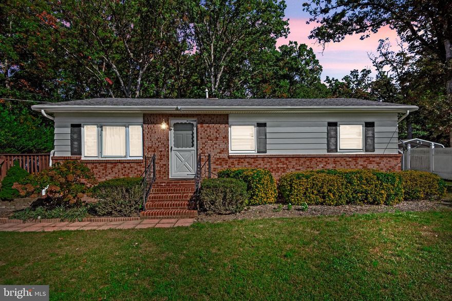 This charming 3-bedroom home is packed with features that are sure to impress! Luxury Vinyl, a modern kitchen, and a spacious open lot make this a perfect choice! The oversized side deck is ideal for entertaining or simply relaxing outdoors. Enjoy peace of mind with a few years of the HVAC system, The A/C one-year-old, the water heater, and the roof. It's just minutes from shopping, VRE, Route 1, Route 3, and I-95! And best of all, there's no HOA! This one won't last long—act fast! MORE PHOTOS COMING SOON