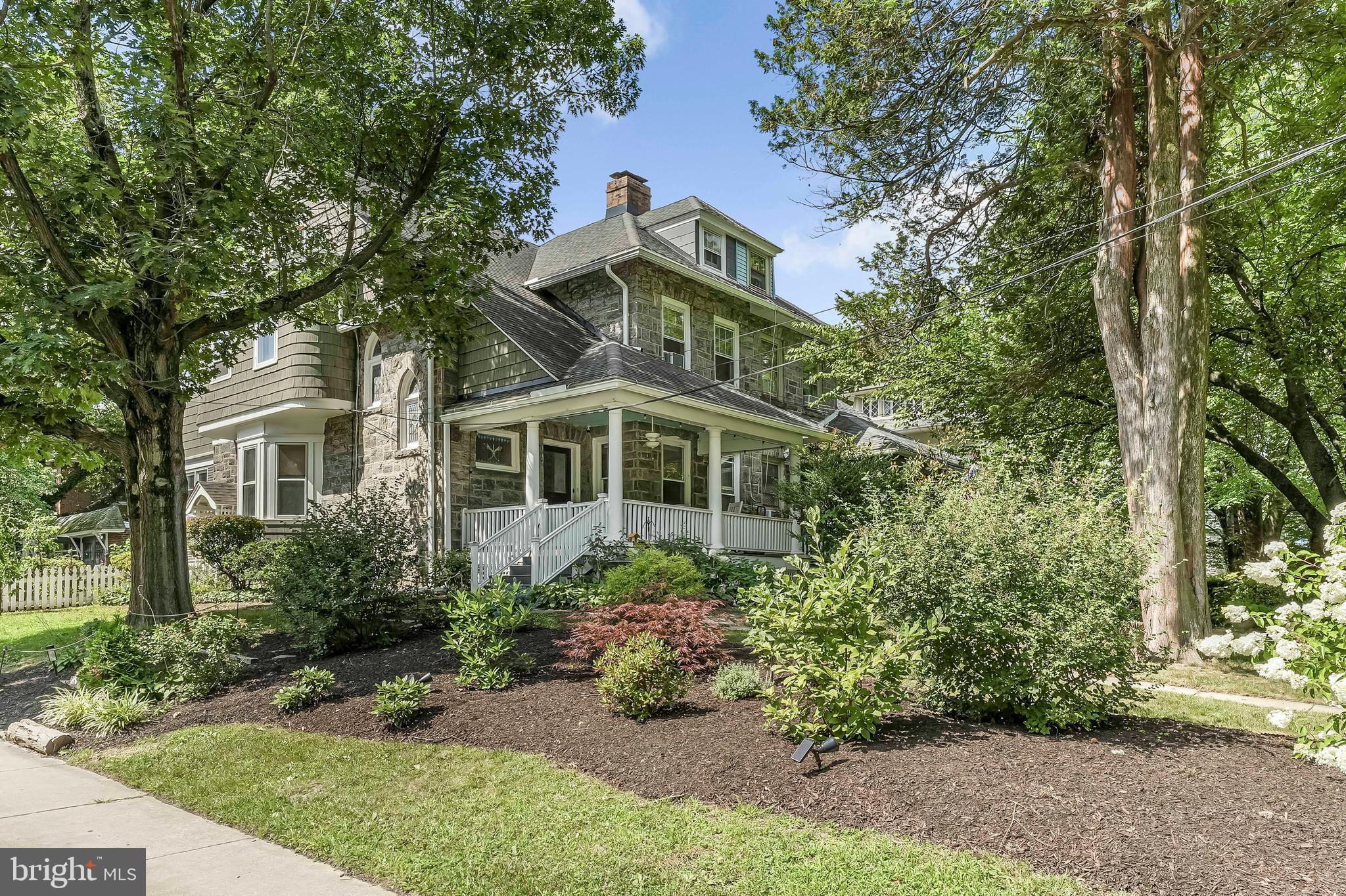 Step into the timeless elegance of this Victorian gem, thoughtfully restored to its original beauty. Nestled on an expansive 8,276 square foot lot, this 3,133 square foot residence boasts high ceilings, five bedrooms, and a sophisticated blend of modern convenience and the classic style of a Victorian. Revel in the charm of rich refinished hardwood floors with walnut inlay, fully functional pocket doors, built in closets/shelves and a cozy fireplace. Every detail has been thoughtfully preserved or lovingly updated. The spacious eat-in kitchen, complete with stainless steel appliances and a butler's pantry, leads to a real gardener's dream of a backyard. The lush garden has newly installed raised vegetable beds, curated herb and fruit gardens and a tranquil flagstone shaded by mature trees, perfect for relaxing, entertaining or simply enjoying nature. The oversized 2 car garage offers parking or storage space in addition to 2 off street parking spaces. The second floor offers 3 wonderfully sized bedrooms and a gorgeous full bath. With the original polished marble sink, new classic hardware and a restored clawfoot tub, the bathroom truly feels like a retreat. The third floor offers 2 more generously sized bedrooms and an oversized closet. Situated in historic Henry Albertson National Historic district of Lansdowne, you don't want to miss this one. From timeless architecture to its garden sanctuary, this home is a rare opportunity to own a true Victorian treasure.