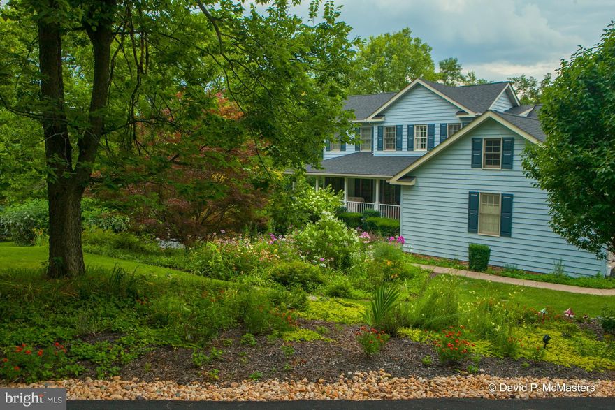 A home to love.  Custom Cedar Colonial on a 1.4 acre gorgeous lot. Your own private park.  Desirable Nollville Manor.  Private. Beautiful plantings, partly wooded, pond. 4/5 BR.  50 yr. roof 2017 + HVAC 2013,14. 2 FP.  Incredible walkout basement w/ quarter sawn oak paneling, Jotul wood stove, office,  built-in book cases. Add adj lot available.  This is a gem.  Min to Marc Commuter train.