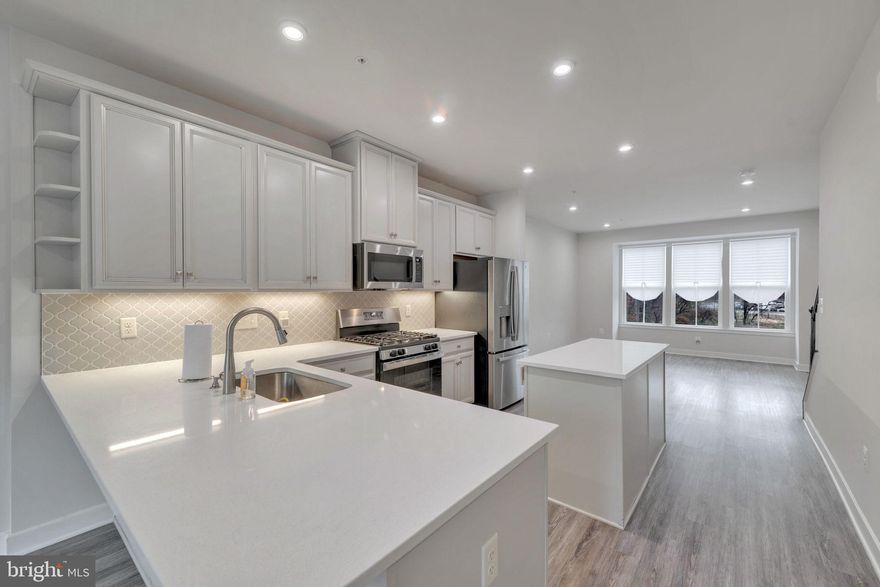 Come see this stunning freshly painted turnkey home. Open concept kitchen with large island, recessed lights, vinyl plank flooring, beautiful light cabinets, gas cooking and stainless-steel appliances. Enjoy the deck off the kitchen.  There is a private full bathroom for each bedroom and a bathroom on every level for convivence.  Just replaced the carpet and toilet seats.  Luxury's include tankless water heater; dual HVAC ran through nest thermostat and both washer and dryer can operate from your own phone and it's on bedroom level. True master bedroom with walk-in closet, blue tooth capability for the ceiling fan and large enough for a king size bedroom suite. Did I mention LOCATION, LOCATION, LOCATION! Metro access is right across the street, walking distance to stadium, and in the beltway. Credit must be a 650 NO exceptions so please don't ask. Pets case by case with additional pet rent and must make 3x the rent amount before taxes.