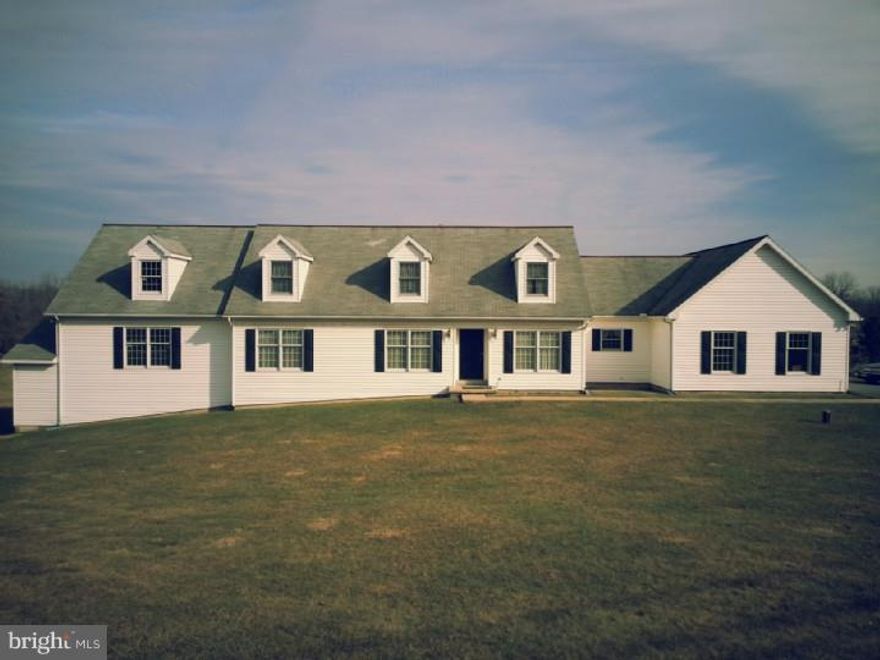 Welcome home to this one of a kind, sprawling cape with almost two acres.  Enjoy the sweeping countryside views from your rear deck. This home boasts neutral d  cor, in law quarters, and an enormous commercial garage in addition to the 2 car attached garage!  Move in ready, but awaiting your personal touches, tremendous possibilities all around!  This is not a drive by.  Call today for your personal tour, this home is truly a unique gem.