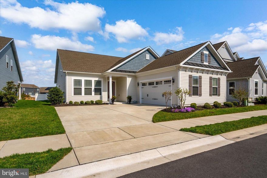 Located in the sought-after resort-style community of Ocean View Beach Club, this award-winning Lewes model offers 4 bedrooms and 3.5 baths. Beautifully situated on a premium beautifully landscaped, pond front lot. This open floor plan features a gourmet kitchen with an oversized granite island with plenty of seating, high-end cabinetry, stainless steel appliances, including a 5-burner gas cooktop with designer hood, wall oven and built in microwave. Oversized pantry and large farm sink. Spacious living area with custom built-in bookshelves/cabinets and fireplace. Nice sized dining space. Inviting sunny foyer / entryway with timeless features including crown molding. Luxurious primary suite with a spa inspired bath. Glamorous frameless shower with floor to ceiling tile and bench. Double vanity sink area with granite countertops. Beautiful upgraded/high-end tile flooring. 3 additional nice sized bedrooms with spacious closets. Generous outdoor space includes an inviting enclosed 3 season room/sunroom/screen porch that opens to the large custom paver patio and overlooks the pond. Enjoy colorful sunsets and skyscapes. Fenced in backyard. Oversized mudroom includes a full-sized stainless steel LG washer and dryer with built in cabinets. One level living. The home includes plenty of storage space, large closets and a 2-car side garage. This home has many well thought out timeless upgrades that include beautiful wide plank high-end engineered flooring, upgraded carpeting and padding and crown molding. All the upgraded flooring throughout the home was carefully chosen. Custom light fixtures and ceiling fans. The home is full of natural sunlight. This home is meticulously maintained and cared for. Well-built/quality craftsmanship by K. Hovnanian Homes. Super house for entertaining friends and family. Premium pond front lot and one of the best locations within the community. Just a short walk to the clubhouse, outdoor/indoor pools, sports courts and beach shuttle pickup. Less than 2 miles to Bethany Beach. Ocean View Beach Club has resort style amenities including large outdoor and newly added indoor pool, beach shuttle, state of the art fitness center, pickle ball, game room and event/social gathering area. Active and fun community offering special events. Ocean View Beach Club is a sought-after community with friendly sidewalks, desirable location and beautiful landscaping. Biking distance to the beach and close proximity to nearby kayak launch. Close to attractions, local eateries, shopping, water activities, fishing, beautiful State Parks, nature trails and golf links.