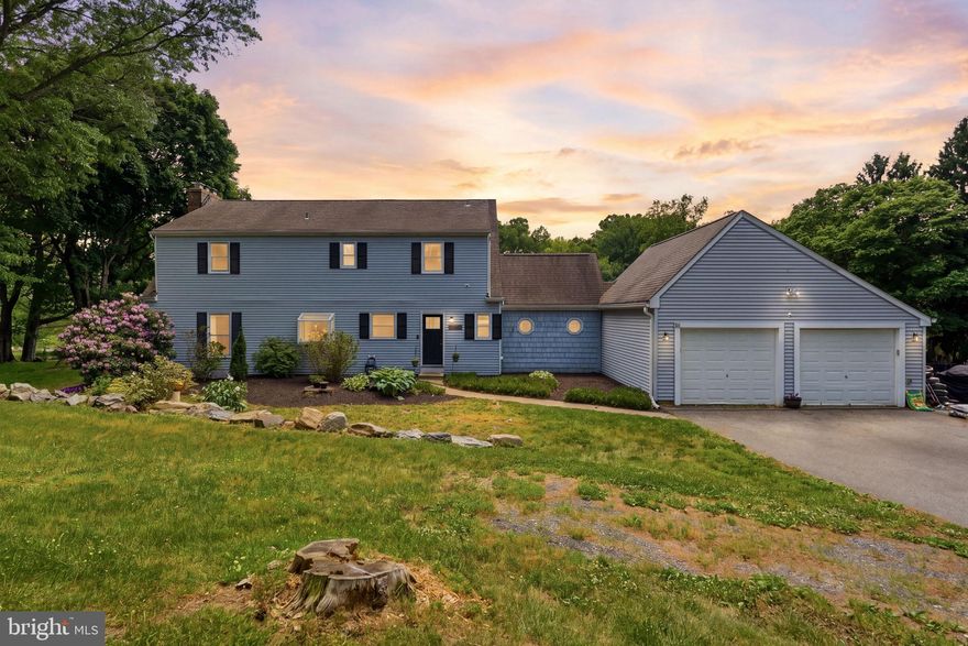 Imagine ending every day with a soft breeze, open land, and a golden sunset- this is what nearly 3 private acres in one of the area's most sought-after locations actually feels like. Minutes from Fair Hill Nature Center, a short drive to Newark's Main Street and the University of Delaware, and an easy shot into Pennsylvania, the setting is rare. But it's the property itself that will stop you in your tracks. Outside, an 18x34 in-ground pool anchors a partially fenced backyard wrapped in mature trees, with a fire pit area, and patio that were made for summer evenings. Inside, the updated main level delivers a cozy country kitchen- granite counters, white cabinets, subway tile backsplash, new plank flooring, and stainless appliances- that flows into a open space eating area and family room with a wood stove and two glass sliders framing stunning rolling hill views. A mud room with vaulted ceilings, wood beams, and custom cabinetry connects to the two-car garage, plus a flexible bonus room works perfectly as a 4th bedroom or home office. Upstairs, the owners suite is anchored by a brick fireplace and barn-style closet doors, with a spa bath featuring a custom tile shower, dual vanity, and soaking tub with brass accents. Two additional bedrooms and a sun-filled loft area- ideal as a reading nook or creative space- round out the upper level. Head down to the basement and you'll find a finished rec room with new carpet and fresh paint, ready to use from day one. A separate unfinished section houses the HVAC and offers serious storage space- the kind that actually keeps the rest of the home clutter-free. Peaceful retreat and entertainer's dream, finally in one place.
