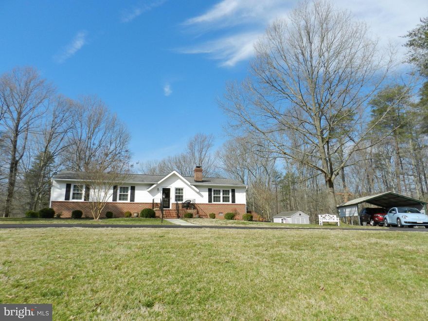 Meticulously Maintained One Level Starter Home situated on 2.58 acres offering over 1,300 sq ft. Hardwood floors fill the entire home. Updated/Modern bathrooms and kitchen. Large maintenance free deck over looks green back yard. 2 storage sheds and 2 carports for added covered storage. New HVAC installed Oct 2015. Less than 9 miles to Spotsy VRE.