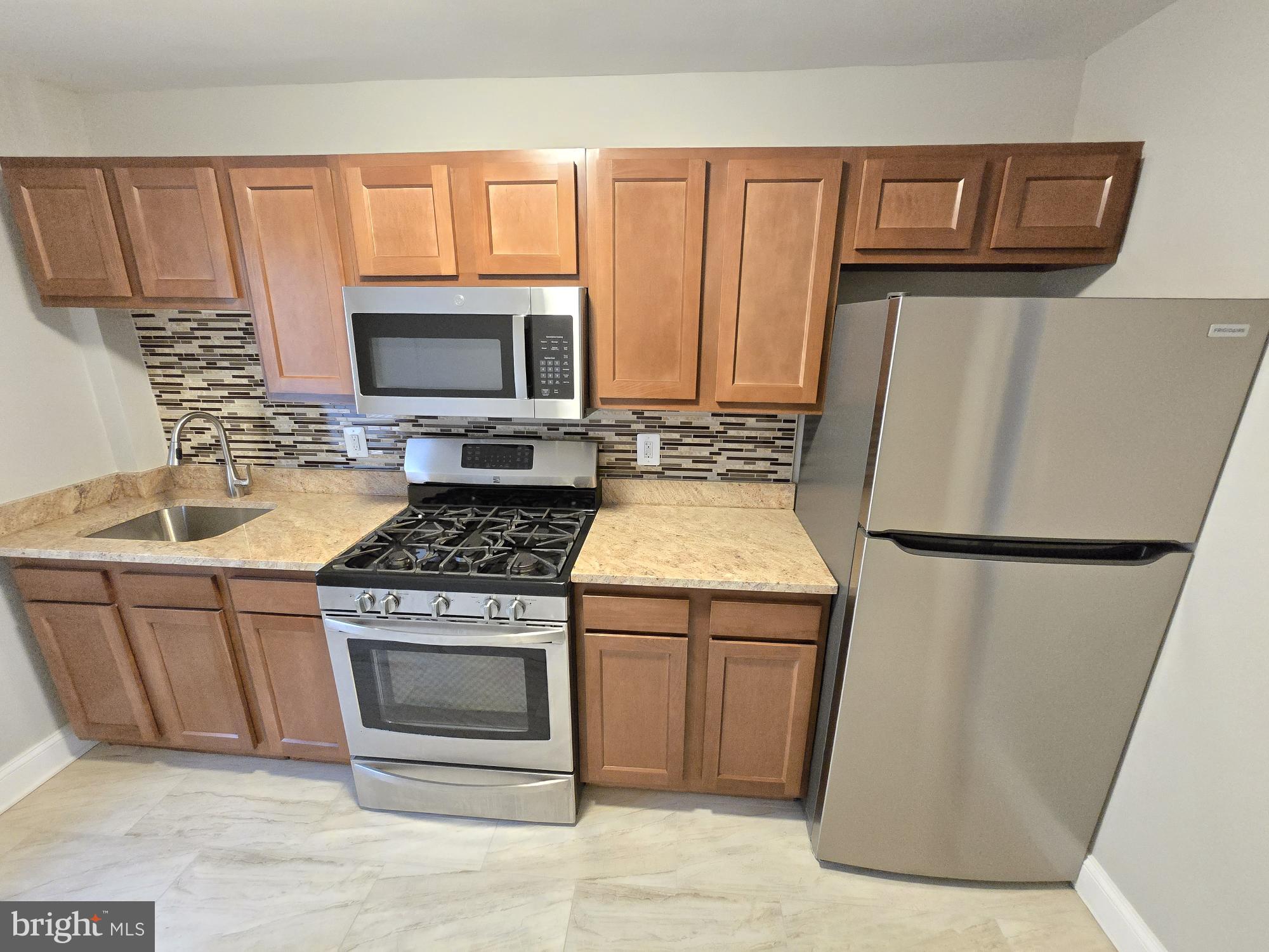 Welcome to our charming 1 bedroom, 1 bathroom apartment located in Baltimore, MD. This second-floor unit features a spacious living room and bedroom with plush carpeting, perfect for cozy nights in. The kitchen boasts ceramic tile flooring and comes equipped with a stove, refrigerator, and microwave for all your cooking needs. Enjoy the convenience of central heat and air, as well as street parking for easy access. The fenced yard provides a private outdoor space for relaxation. The bathrooms feature ceramic tile floors and shower areas for a touch of luxury. With hallway flooring in luxurious laminate, this apartment offers a comfortable and stylish living space for you to call home.
Application Qualifications: Minimum monthly income 3 times the tenant’s portion of the monthly rent, acceptable rental history, credit history and criminal history, which all must be verifiable. The application fee is $40 per adult which is non-refundable. They must submit their two most recent pay-stubs along with picture I.D.