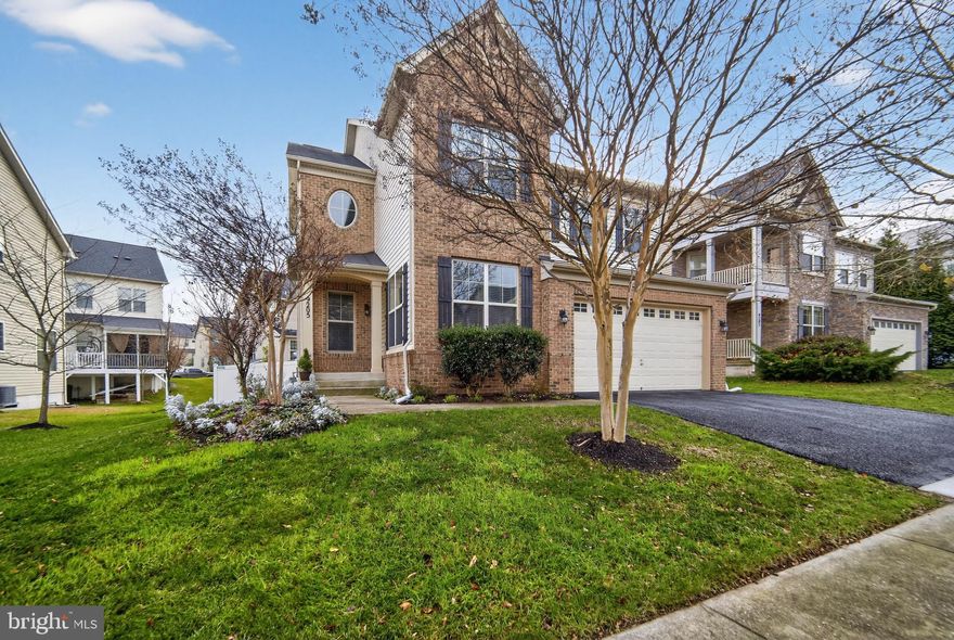 Welcome to 9205 Rice Avenue, Lanham, MD 20706
OPEN HOUSE NEXT SUNDAY, DECEMBER 14TH -1PM-4PM

Discover luxury living in this stunning DR Horton Easton model offering over 4,355 square feet of living space in the highly desirable Woodmore Towne Centre community. This spacious 5-bedroom, 4.5-bath residence showcases thoughtful upgrades, comfortable living spaces, and an effortless flow designed for modern lifestyles.

The inviting main level features hardwood flooring, a dedicated office, and separate living, dining, and family room areas. The gourmet kitchen is the heart of the home, equipped with 42-inch white cabinetry, stainless steel appliances, an eat-in dining space, and a breakfast bar ideal for casual gatherings. The family room includes a gorgeous stone-surround fireplace, while generous windows bring in natural light throughout.

Upstairs, the expansive Owner’s Suite offers a private luxury bath with a large shower and a custom walk-in closet, providing an elegant retreat. One secondary bedroom includes its own private full bath, and the conveniently located upstairs laundry room offers extra storage space, adding to everyday ease.

The fully finished lower level is designed for entertaining, with luxury vinyl flooring, a state-of-the-art bar featuring a refrigerator and wine cooler, and a stylish stone accent wall with an electric fireplace. Walk out directly to the backyard for seamless indoor/outdoor living.

Step outside to enjoy the screened-in porch, lower paved patio, large fenced rear yard, sprinkler system, and mature landscaping—perfect for relaxing or hosting. The 2-car garage is upgraded with cabinetry and epoxy floors, while the driveway accommodates up to two additional vehicles.

This home offers a neutral color palette, excellent natural light, and has been well-maintained and thoughtfully improved, delivering true move-in-ready condition. Conveniently located moments from dining, shopping, and everyday conveniences at Woodmore Towne Centre, this is an exceptional opportunity to enjoy comfort, space, and community living in Lanham.

Welcome home!  This one won’t last long at all.  Schedule Your Appointment TODAY!!!