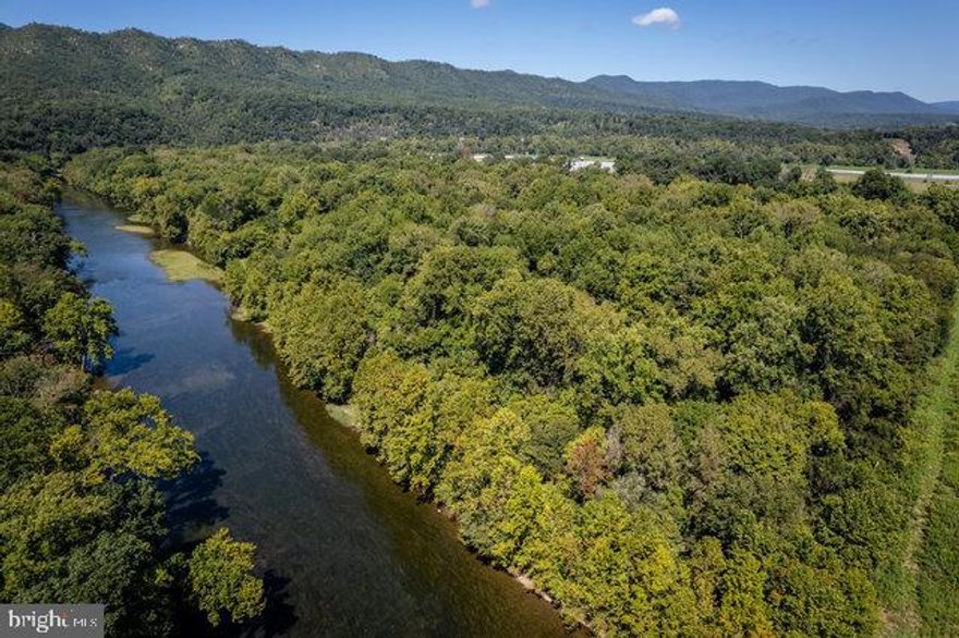 Unique opportunity to own tranquil river front property. This 5.8 acre lot in Mill Run Subdivision is mostly wooded, level, and features easy/shallow access to the river. Ideal for recreation/vacation/second home - build your dream cabin or use as a basecamp for adventures at Shenandoah National Park, Appalachian Trail, and Massanutten Resort. Appointment required - no drive-bys.