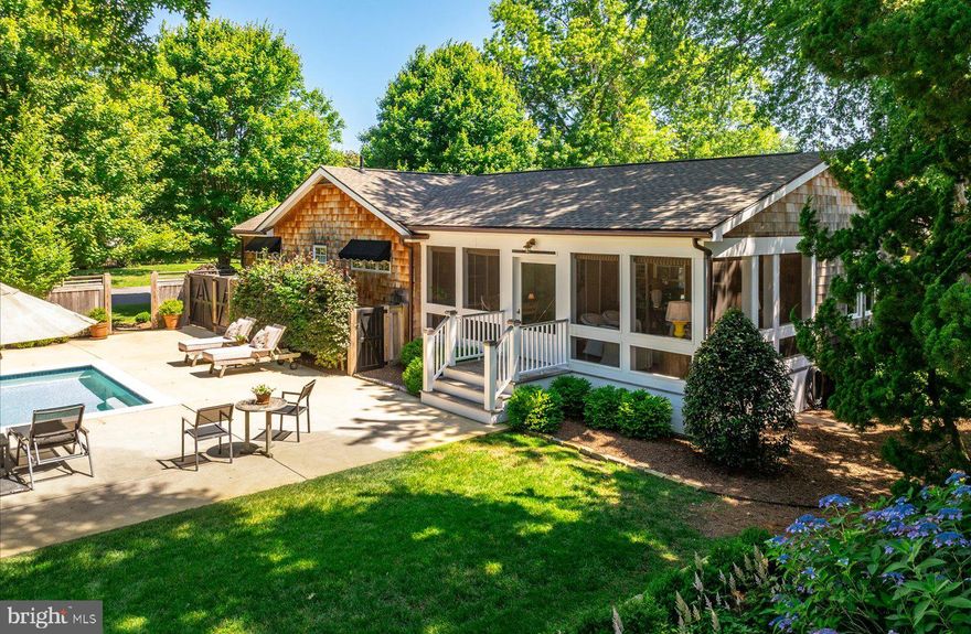 English countryside charm meets coastal cottage living in this exceptional home tucked within the desirable Schoolvue community of Rehoboth Beach. Set on an expansive 125' x 100' lot, the property offers privacy and serenity surrounded by mature trees and lush landscaping. A slate walkway leads to the inviting entrance of this classic shaker-style cottage, where a welcoming front porch sets the tone for seaside living. Inside, timeless details abound. Crisp white pine paneling and wide-plank oak flooring flow throughout, while carefully curated lighting adds warmth and character to each space. The kitchen is a chef’s dream, designed with both form and function in mind, featuring abundant storage, a 6-burner Thermador gas cooktop, dual ovens, and a Sub-Zero refrigerator. The cozy family room is anchored by a gas fireplace, beamed ceilings, and sun-filled windows that frame the natural beauty outside. The thoughtful split floor plan includes four comfortable bedrooms, each with its own designer personality, and two bathrooms with classic finishes, including carefully selected Barber Wilson fixtures. Outdoor living is where this property truly shines. A spacious screened porch provides the perfect setting for casual dining or quiet evenings, while the large 15’ x 30’ heated pool, patio, and professionally landscaped grounds create an ideal space for entertaining or unwinding. Located just a few blocks from downtown Rehoboth and its renowned beaches, this home blends timeless style, modern comforts, and rare privacy in one of the area’s most sought-after neighborhoods. A truly unique opportunity for the most discerning buyer.