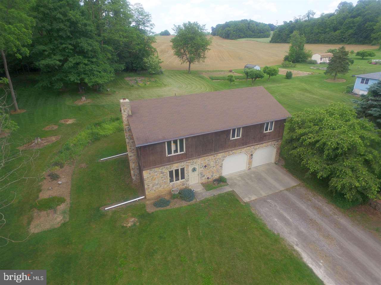 Nice ranch home nestled in the country. This 1932 square feet home features 3 bedrooms, 1.5 baths, large kitchen and dining room with sliding doors to a large raised deck on the back of the house. This home also has a large family room with interior access to the large 2 car garage.