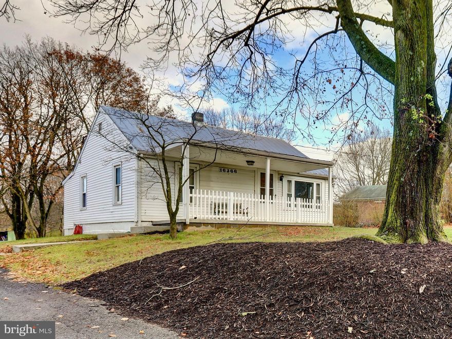 Welcome to 16366 Spielman Road, a charming 2-bedroom, 1.5-bath home set on just over an acre of open land in a peaceful Williamsport setting. Perfect as a first home, a downsize option, or a quiet country retreat, this property blends classic character with comfortable everyday living.

Inside, the home features a cozy living room filled with natural light and an inviting atmosphere. The spacious eat-in kitchen offers ample cabinet storage, stainless steel appliances, and room for a dining table—creating a natural gathering space for meals and conversation. A convenient laundry area and half bath are located just off the kitchen. The primary bedroom is located near the kitchen, while the second bedroom sits on the opposite end of the home; both are served by a full bath.

Outdoor living is one of the highlights of this property. A covered front porch provides a welcoming spot for morning coffee, while the rear porch offers additional outdoor space overlooking the expansive backyard. With over an acre of flat, usable land, there’s plenty of room for gardening, outdoor activities, pets, or future additions. A detached garage and a separate shed provide ample storage for tools, equipment, and seasonal items.

Located just outside the town of Williamsport, this home offers easy access to local parks, the C&O Canal, and the Potomac River for fishing, boating, and recreation. You're also within minutes of shopping and dining in Hagerstown, and commuters will appreciate proximity to I-81 and I-70, making travel to Frederick, Martinsburg, and beyond a breeze.

Offering space, simplicity, and everyday convenience in a tranquil setting, 16366 Spielman Road is ready to welcome you home.