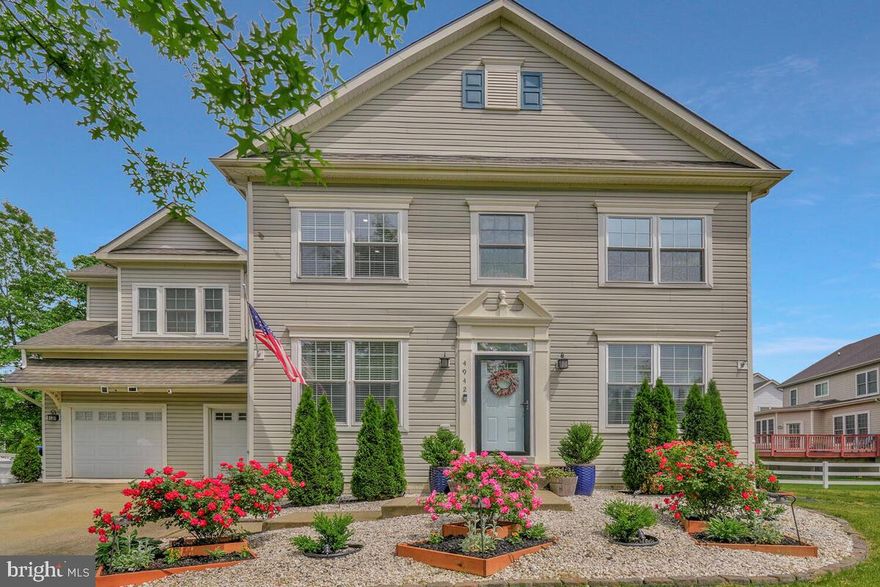 Welcome to 4942 Deal Court—an immaculate 5-bedroom, 4.5-bath Colonial located on a quiet cul-de-sac in the highly desirable Sheffield community. Thoughtfully designed across three fully finished levels, this spacious residence combines timeless charm with modern upgrades, offering an ideal balance of comfort, convenience, and contemporary style.  As you enter, gleaming hardwood floors greet you and a flowing layout that includes formal living and dining rooms, plus a gourmet kitchen outfitted with recessed lighting, newer stainless steel appliances, a built-in microwave, granite countertops, 42" soft-close cabinets, a stylish backsplash, a large breakfast peninsula, and a pantry. The kitchen seamlessly opens to a light-filled family room with a gas fireplace—perfect for unwinding or hosting company—and a versatile flex room ideal for a home office, library, or potential main-level bedroom. A recently beautifully updated powder room and a utility room complete this level. Upstairs, you will find two luxurious primary suites, each with walk-in closets and updated en-suite baths accentuated with quartz countertops, plus two additional bedrooms and a full hallway bath. The fully finished basement—with its own private entrance and sump pump—adds valuable living space featuring a fifth bedroom, fourth full bath, recreation area, a second gas fireplace, and a dedicated home theater complete with projector and screen. This versatile level is perfect for entertaining, relaxing, or accommodating overnight guests! Notable recent upgrades include a newer HVAC system with Smart Thermostat (less than 2 years old), and updated closet systems, lighting, ceiling fans, blinds, keyless entry, and security system. Step outside to enjoy the spacious fenced backyard designed for both daily use and weekend play. Highlights include a custom paver patio, a charming apple tree, an inviting fire pit area, an outdoor activity set, a trampoline, and three sheds for added storage. An expansive 2-car garage offers shelving and convenient interior access, complemented by an extended driveway that provides ample additional parking.  As a resident of Sheffield, you’ll enjoy access to exceptional community amenities, including a clubhouse, swimming pool, walking trails, tennis courts, playgrounds, and a picturesque lake. This prime location also offers convenient proximity to major highways, commuter routes, shopping centers, restaurants, parks, and various entertainment options. Don’t miss your chance to own this exceptional property that combines style, space, and unmatched community living. Make 4942 Deal Court your forever home today! Don’t miss your chance to own this exceptional property that combines style, space, and unmatched community living. Make 4942 Deal Court your forever home today!