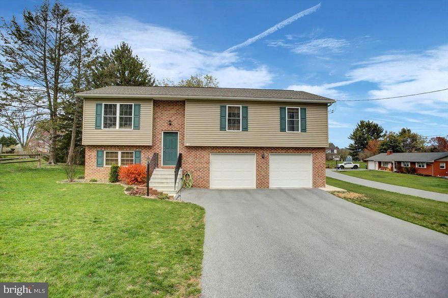 Attractive almost new Bi-level situated on a spacious .45-acre corner lot.  Double oversized attached garage with additional side entry door for outside convenience. Modern exterior colors with brick and vinyl siding. Interior includes three bedrooms and two- and one-half baths. The upper floor consists of the primary bedroom with full bath, two more spacious bedrooms share the second full bath. All bedrooms have feel good carpet for comfort and warmth. The remainder of this floor enjoys easy care flooring. An expansive kitchen is open to the inclusive dining area, which has sliding glass doors opening onto a welcoming deck. The kitchen has solid countertops featuring a breakfast bar, stainless steel appliances, and a stainless double sink.
A generous light filled living room/family room completes the upper level.
 In the lower level you will find another huge family room with sliding doors opening to a concrete pad and the large rear yard. On this floor you will also find the laundry room and half bath, a deep oversized garage giving access to the home, as well as the propane furnace. Economical propane gas and central air, current paint colors with all the other amenities make this a very desirable home to call your own!