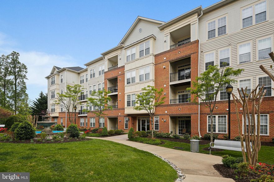 Spacious Ellicott Hills condo with two bedrooms, two baths and rare bonus family room/den off the kitchen.  Fresh paint throughout.  Crown moldings in the living and dining rooms. Kitchen with center island, premium cabinets and corian counters.  Large primary bedroom with walk-in closet and full bath. Corner unit provides lots of natural light.  Balcony off the living room with expansive views.  Enjoy the community amenities which include the outdoor pool, clubhouse, and fitness room. Shows well.