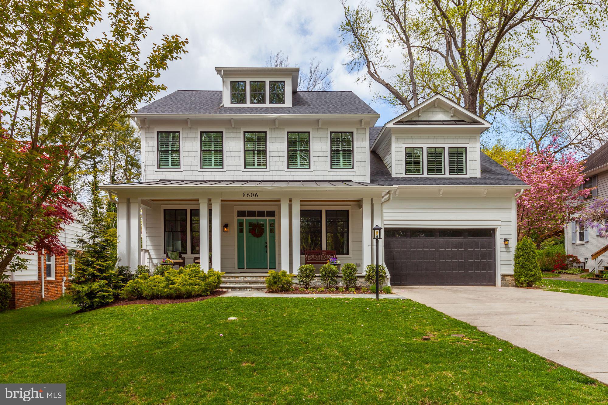 Picture perfect Arts & Crafts home built in 2017 by award winning Foxhall Builders. This home features four luxurious levels with six bedrooms all with en suite bathrooms and one-half bath. Guests are welcomed with a beautiful flagstone front porch and tiffany blue front door. The first level includes a home office with custom built-ins and French doors. An elegant dining room with classic wainscoting moldings is perfect for entertaining and family gatherings. A butlers pantry complete with beverage center and built in wine storage leads to the stunning chefs kitchen. The expansive kitchen features custom white cabinets, granite countertops, white subway tile backsplash, pot filler, stainless steel appliances, under counter lighting, and expansive island seating. An oversized mudroom with built in cubbies, prep sink, and large walk in pantry are conveniently located of the kitchen with access to two car garage (complete with charging station). The chefs kitchen is open to the breakfast area and family room. The family room features a gas fireplace and a coffered ceiling. The family room and breakfast area lead out to the beautifully landscaped flat, fenced backyard with flagstone patio. A powder room with custom wainscoting and Kohler fixtures finish the first floor. A light filled side staircase leads to the upper level. The second floor boasts hardwood floors throughout, four bedrooms all with en suite bathrooms. A luxurious king size master suite provides a coffee/wine bar. The spa-like bathroom provides Rohl fixtures, his and hers vanities, soaking tub, heated floors, and large shower with frameless glass enclosure. A large walk in closet with access to laundry room complete the master suite. The basement provides an enormous recreation room, bar, sixth bedroom with full bathroom, wine storage, and an oversized storage area. This home is located just moments from downtown Bethesda and walking distance to Walt Whitman High School! This home is truly picture perfect and move in ready!