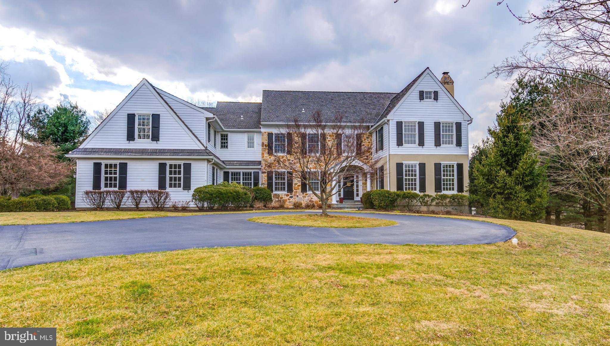 Introducing 912 Castlehill Lane in Devon...a gorgeous 5 Bedroom, 3.2 Bath luxury home gracefully sited on over 2.6 acres of lush land in prestigious Easttown Township. A distinctive and small neighborhood setting on a single cul de sac street with homes that rarely come onto the market. Thoughtfully designed and featuring beautiful finishes, this elegant and warm home will impress the most discerning buyer. Discover a versatile floorplan that is ideal for both daily casual living and large scale formal entertaining. Upon approaching the home, one will appreciate the stately curb appeal with circular driveway. Enter the gracious 2 story Foyer and discover light filled rooms, rich hardwood flooring, custom built-ins, lovely millwork, a peaceful color palette, multiple fireplaces, 2 stairways and the list of fine features continues. The updated gourmet Kitchen provides an abundance of cabinetry, center island, Sub-Zero and Wolf appliances, gas cooking, decorative tile backsplash, a wonderful Butler's Pantry located next to the formal Dining Room, convenient mini office nook and adjacent Breakfast Room with doors leading to the flagstone terrace. The alluring Family Room may be the heart of this home featuring a stone floor to ceiling wood burning fireplace with raised stone hearth, expansive windows, custom built-ins and a vaulted ceiling. Enjoy the open Living Room with gas fireplace which has been the venue for numerous musical recitals. A quiet 1st floor Office with a wall of built-in shelving and cabinetry is ideal when working from home. Two Powder Rooms, a Laundry Room, bonus Mud Room/Flex Room and access to the 4 Car Garage complete this well laid out first floor. Ascend the main front staircase and enter the delightful Master Suite which boasts a lovely Bedroom with Sitting Room offering terrific bookshelves and wonderful space. The newly renovated master Bath is sure to please with radiant heated tile flooring, warm rich tones, two vanities, a soaking tub, oversized shower with glass enclosure, designer large scale tile and a substantial walk in closet. The four additional Bedrooms each feature a walk-in closet, neutral carpet and great natural light. Two Jack and Jill full Baths service these bedrooms. The back stairway at the end of the hallway is most convenient. Wonderful additional finished living space is found in the Lower Level offering plenty of room for movie watching, game playing, a pool table, an exercise area plus multiple unfinished areas for storage. Outdoors enjoy the sweeping landscape with professional landscaping, mature plantings and trees and a flagstone patio which is the optimal setting for relaxation. This very special property is located in the top rated Tredyffrin-Easttown school district and is a stone's throw to The Episcopal Academy and other independent schools. Super access to major arteries, the train, Philadelphia Int'l Airport, Center City and numerous corporate parks simplifies one's commute. Enjoy all of the fine dining, shopping and recreational outlets the greater Main Line offers from this dynamite location! Welcome home...