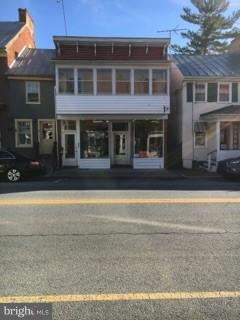 Large apartment above storefront in Shepherdstown. Three bedrooms, one bath, washer and dryer, two off street parking spaces, fenced yard and a storage shed.