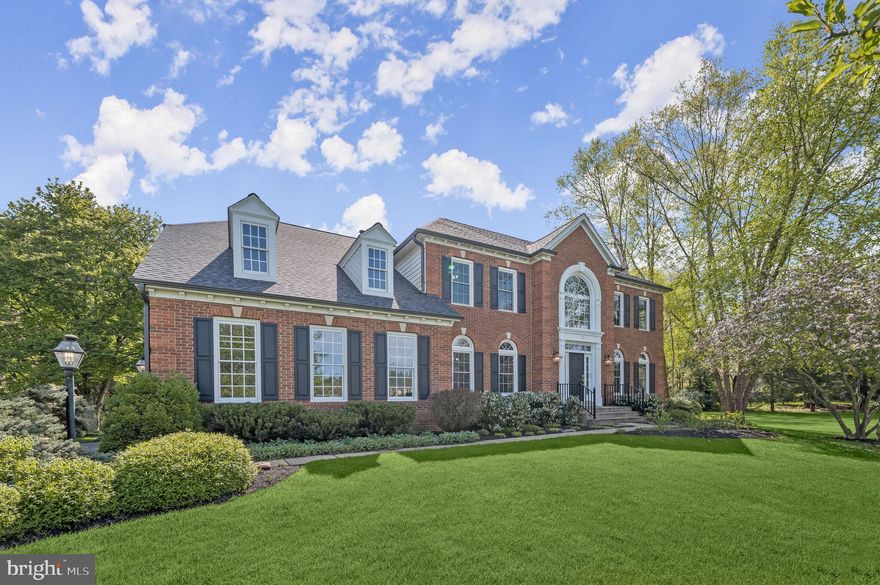 Elegant Colonial is nestled on a picturesque 1.38-acre lot in the coveted community of Shaneybrook.
Grand two-story foyer flanked by formal living and dining rooms featuring stately columns, rich hardwood floors, and intricate crown moldings. The heart of the home is the chef's eat-in kitchen, designed to inspire culinary creativity. It boasts granite countertops, decorative backsplash, a double wall oven, and an expansive center island with a breakfast bar. The kitchen is also equipped with a convenient pantry and a dual staircase leading to the upper level. The breakfast room, with its floor-to-ceiling windows, offers stunning views of the lush backyard, creating a serene atmosphere to start your day. Adjacent to the kitchen is the inviting family room, complete with a cozy fireplace and access to the deck, perfect for indoor-outdoor living. The main level also includes a private office, a powder room, a mud/laundry room, and direct access to the garage. Ascending to the upper level, you'll discover the luxurious primary suite. It features a sitting room, soaring cathedral ceilings, and a wing leading to dual walk-in closets, a dressing area, and a lavish en-suite bath. The primary bath offers a glass-enclosed shower, slipper tub, dual vanities, and a water closet for added privacy. The upper level also includes an en-suite bedroom with a walk-in closet, plus two additional bedrooms sharing a dual-entry full bath. This setup is ideal for family or guests, providing both comfort and convenience. The lower level offers a versatile space with endless possibilities. It can be used as a game room, exercise area, or anything else you can imagine. Additionally, there's a dedicated bonus room, a full bath, and ample storage space. This home has been meticulously maintained and updated with a host of recent improvements, including a new HVAC system, roof, gutters, oversized downspouts, windows, hot water heater, carpet and a deck with a retractable awning. The refinished floors add an extra touch of elegance to this already stunning property.