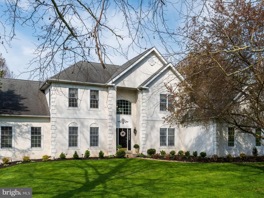 Welcome to one of Chester County’s most picturesque retreats. Situated on a premium cul-de-sac lot within the prestigious Brandywine River Estates, this stunning 4 bedroom, 3.5 bath home offers a lifestyle of serenity and sophistication. This boutique community of just 53 homes is nestled on a wooded hillside overlooking the confluence of the East and West branches of the Brandywine River. Residents enjoy nearly 65 acres of preserved open space with a private walking path, providing a park-like atmosphere right outside your front door. From the moment you arrive the new professional landscaping and grand two-story foyer set a tone of refined elegance. To the left, the living room features rich hardwood flooring and classic crown and chair moldings. Step down into the spectacular conservatory, a versatile sun-drenched sanctuary encased in five arched triplet windows plus two additional single windows. Whether utilized as a music room, yoga studio or lounge this space is an architectural highlight of the home. The formal dining room adorned with wainscoting and an impressive chandelier flows effortlessly into the chef’s kitchen. This heart of the home features premium stainless steel appliances and double ovens. A large center island, skylights, corian countertops, walk-in pantry and breakfast room with atrium doors leads to an expansive rear deck. Adjacent to the kitchen, the family room is a masterclass in design, featuring coffered ceilings and a breathtaking two story stone wood-burning fireplace flanked by arched windows. Atrium doors lead from the family room to the impressive deck.  A second staircase provides convenient access to the upper level while a private executive study with custom built-ins offers the perfect quiet environment for remote work. The second floor is home to four beautifully appointed bedrooms but the primary suite is the true showstopper. The bedroom features a soaring tray ceiling and elegant moldings leading into a custom-designed dressing room that must be seen to be believed. This “dream” space features an oversized center island with a striking crystal chandelier, boutique-style custom cabinetry and comprehensive organization, dedicated vanity nook for hair and makeup plus a bright, white on white primary bath with a jetted tub, seated shower and privacy toilet. Two additional bedrooms share a spacious Jack-and-Jill bath with double sinks and the other guest room features a private ensuite bath. The spacious three car garage comes equipped with a dedicated EV charger. The massive 2.485 sq. ft. unfinished walk out basement is a blank canvas. With high ceilings, multiple large windows and atrium doors leading to the backyard, it is perfectly suited for a future theater, gym or wine cellar. Multiple composite decks-including a retractable awning-offer the perfect vantage point to enjoy the hillside views. Experience the best of Chester County living within the award-winning West Chester Area School District. You are minutes away from the vibrant shopping and dining of downtown West Chester with easy access to major commuter routes and the Philadelphia International Airport. Welcome home! Click on the movie camera icon to see a slideshow of this lovely home.