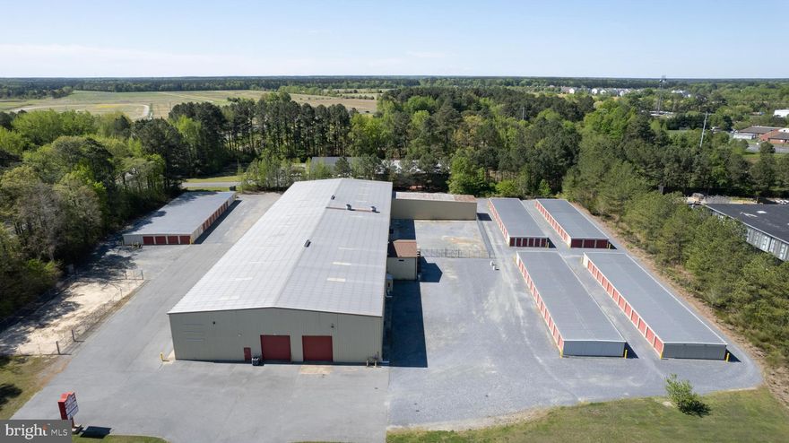 Cambridge - income producing property on 5 +/- acres.  Improvements include a 30,000+/- sq. ft. warehouse/industrial building currently configured into 3 spaces plus a retail showroom (Fire Marshall approved), fully sprinkled, upstairs offices  plus a fenced yard area. Recent bathroom, roof  and HVAC upgrades.  LED lights throughout.  Owner's office features heated floors.
 Additional improvements include  (4) 130' x 30'  mini storage buildings plus a 150' x 55' climate controlled mini storage building, and (4) contractor units running at 95%  to 98% occupancy.  There is an additional fenced storage yard on the property.  Nice signage and recent upgrades to the parking lot.
Just off Rt. 50 on the corner of Rt.16S and Chesapeake Drive.