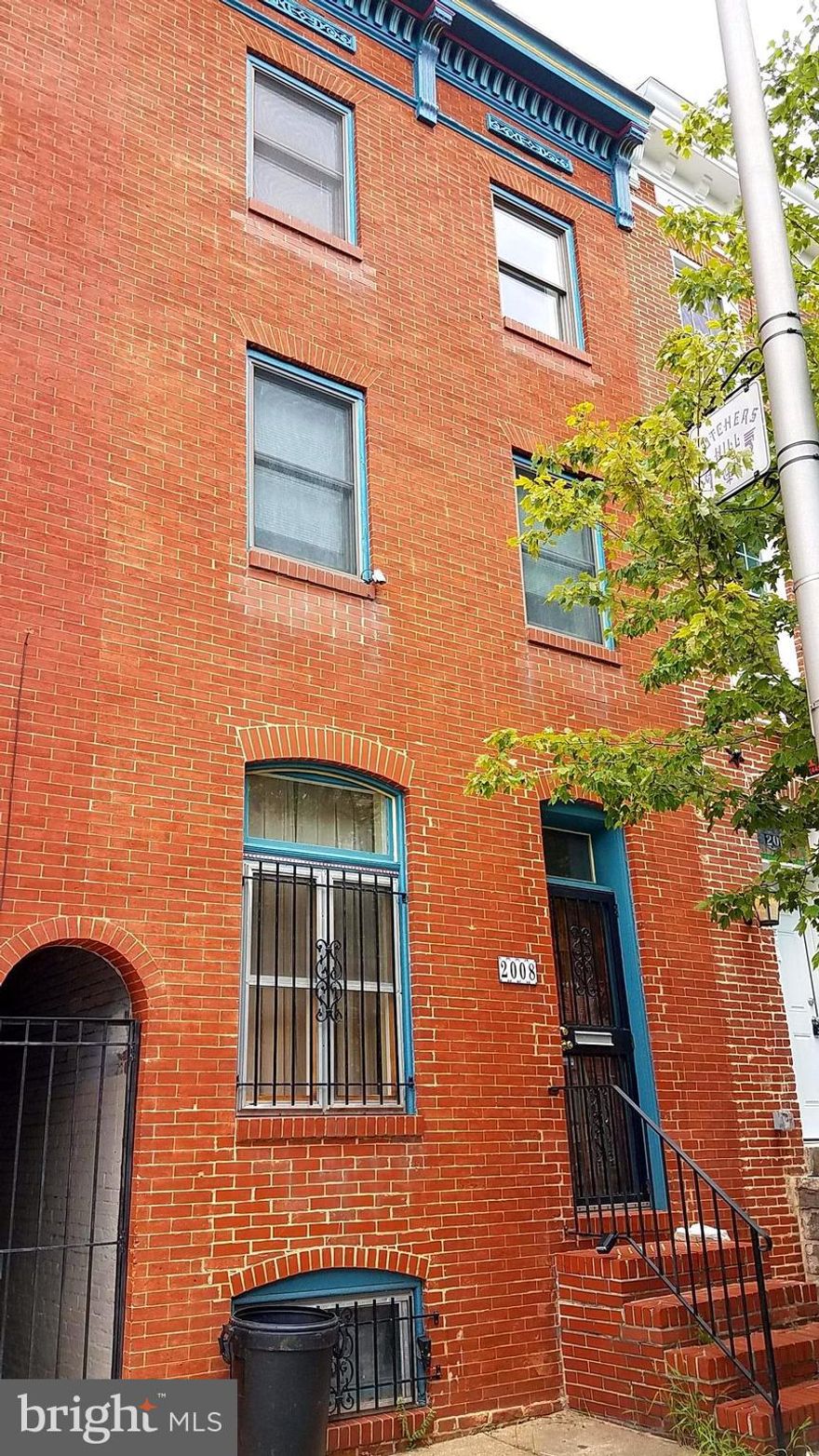 LARGE 3 STORY HOME IN PRIME BUTCHERS HILL LOCATION W/SWEEPING WATER VIEWS and PARKING POTENTIAL! Original staircase, tall ceilings, fireplace, great floor plan, generous room sizes, multiple decks and tremendous potential to be a shining gem again! Prime candidate for a home owner looking to get into historic Butchers Hill on day 1 and do some handywork to build your dream home! Sold as-is