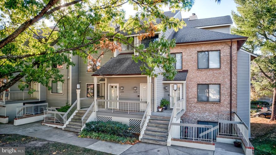 Welcome home to this spacious and airy condo located in the waterfront community of Harbor Point on Lake Thoreau! Surrounded by the great amenities Reston has to offer, this 3-level, 2-bedroom, 2 full bathroom condo is ready for you to enjoy! Waterfront views are available from both the main and upper level, as well as from your deck, which is accessible from both the dining area and the living room. The 2-story entrance foyer has ceramic tile floors and a convenient coat closet. The one-car garage (#34) is located directly across from the condo. There is also an additional parking space (with parking tag). The main living level has hardwood floors, a wood-burning fireplace in the living room and skylights in the dining area. There are also 2 sliding glass doors leading to the deck with lake views. Bedroom #2 is located on the main level and features a walk-in closet and access to the full hall bathroom. The hall bathroom has ceramic tile floors and Italian stone countertops with custom solid cherry cabinets. There is a spacious alcove in the hall with built-in bookcases along two walls. The primary bedroom is located on the upper level, complete with a vaulted ceiling and water views. Double doors open to the primary bathroom with a jetted tub, separate shower, large window and a walk-in closet. The upper level also has a spacious den/flex space with great natural light.  The stacked washer and dryer and an additional finished storage room is also on this level. Enjoy Harbor Point's community dock, plus easy access to all of Reston's amenities just steps away including swimming pools, pickleball and tennis courts, and miles of Reston's trails - so convenient! And South Lakes Shopping Center offers dining and shopping - including Cafesano and Red's Table. And the Wiehle Ave. Silver Line Metro at Reston Station is just a mile away. Schedule a showing today! This is a special spot!