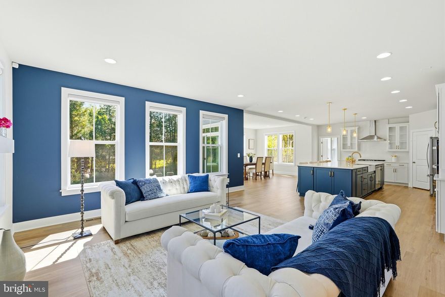 Experience the best of both worlds in this incredible NORTH-EAST facing home, situated on a 0.23-ACRE lot! Enjoy brilliant natural light throughout the day, from warm morning SUNRISES to a golden evening SUNSETS. This charming home seamlessly blends INDOOR & OUTDOOR living; features a newly installed, expansive $40K stone patio complete w/built-in seating, creating an elevated private oasis perfect for relaxing & entertaining. Illuminated tile path provides convenient front-to-back access between the patio & driveway. SPRINKLER system in place for lush green lawn.  Softly lit front pathway through luminous landscaped plant beds to a homey covered front porch; the perfect, tranquil spot for your morning coffee or a relaxing evening drink.<br><br>This meticulously maintained home boasts 5,528 FINISHED sq ft across 3 levels, offering 6 bedrooms, a powder rm, & 5 beautifully upgraded full baths displaying luxurious quartz countertops, floor-to-ceiling FULL-WALL tile, & large FLOOR tile showcasing a high-end cohesive aesthetic throughout. Soaring 9-foot ceilings at all levels enhances ventilation, ensuring a consistently airy & breezy atmosphere.<br><br>CONVEYANCES: Front door ring doorbell, exterior garage & rear rechargeable outdoor cameras, patio & basement doors wired flood light cameras. Indoor motion detectors & exterior door sensors. Mounted wi-fi points at each level.<br><br>CUSTOM BLINDS: Motorized in fam & morning, retractable in lib & din, & cellular in remaining areas including garage.<br><br>IMPOSSIBLE to overlook the INCLUSION of main, guest, & bsmt bed rm w/attached baths, cozy mud area, morning rm, loft, primary bed rm sitting area, media rm, & side areaway in this streamlined drawn FLOORPLAN.<br><br>Discover unparalleled craftsman elegance, lasting value, and impeccable care! Glass front door | French double glass doors & box window in lib | 36" Linear gas fireplace w/mantel | Modern trim package | Oak staircase w/white risers & balusters at all flights | Wide plank LVP floors at main level, loft, laundry, primary bed rm, sitting, & rec | Ecobee thermostats | Smart switches in fam, kit, & basement | Rinnai tankless water heater | Reverse Osmosis water filtration at kit sink | Whole house water softener | Closet system in pantry & primary's his & her walk-in closets | Shelving in main bed rm closet & two coat closets | Walk-in showers at main, primary, & bsmt | Home theatre pre-wire ready | Wet bar rough-in | Bed rm level laundry w/huge pedestal Washer-Dryer & tub | Two-Zone HVAC | HDMI cable, data, & flat TV prewires at numerous locations | Plenty recessed | Ceiling fans in all bed rms, prewire at bsmt bed rm | Long driveway that comfortably fits 4 cars | Side load garage w/epoxy floors, belt garage door opener, keypad, & 220 volt plug<br><br>KITCHEN is a show stopper! CHEF's GOURMET kitchen w/Whirlpool Appliances, two-tone cabinetry layout, glass cabinets, soft-close feature, pull out trays, trash & recycle bins, elegant hardware, floating shelves, quartz counters w/running quartz backsplash, oversized undermount apron sink, pendants, & humongous center island that serves as a generous workspace/a spot for homework/space for meals/gathering area.<br><br>HARTLAND sub-division HOA: Includes Verizon gig-speed internet, snow removal, trash & recycle pickup. Amenities: Greeting House, Hartland House, state of the art fitness center, kids' rm, locker rms, a great rm, a kitchenette w/bar seating, a 6-lane pool, tennis courts, basketball, pickle ball, & tot lots. Proximity to Old Farm Winery, Hal & Berni Hanson Regional Park, Stone Springs Hospital Center, Loudoun County Gum Spring Library, Dulles International Airport, Loudoun Station, Brambleton Town Center, Broadlands Village, One Loudoun, Dulles Landing, state of the art library @ Brambleton Town Center, upcoming Avonlea & Arcola Center,  Restaurants, boutique retailers, movies, meeting places, parks, recreational areas & intricate trail network.