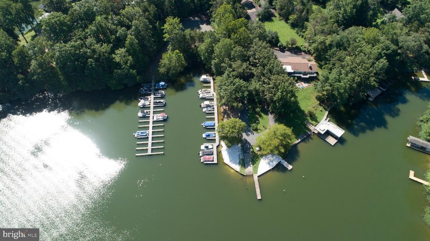 Discover the perfect blend of space, scenery, and lake life with this rare 2-acre water-access lot on Lake Anna's Public Side. Ideally positioned on a gentle, elevated knoll, overlooking the neighborhood, this property has already been approved for a 4-bedroom conventional septic, giving you a head start on making your dream home a reality. Just a short walk or golf cart ride away is the Morgan I Common Area, where you’ll enjoy your assigned boat slip, located at Pier 2, Boat Slip #10. Enjoy the use of not just one, but two common areas! Located just across the street is Morgan II.  Both common areas offer lots of amenities, including: boat launches, sandy beaches, designated swimming areas, plus picnic and grilling spots for endless days of relaxation and fun. Convenience meets recreation with The Cove at Lake Anna waterfront restaurant and Hunters Landing Marina just around the corner. Secure this rare, well-situated water-access lot and start building the Lake Anna lifestyle you’ve always imagined!