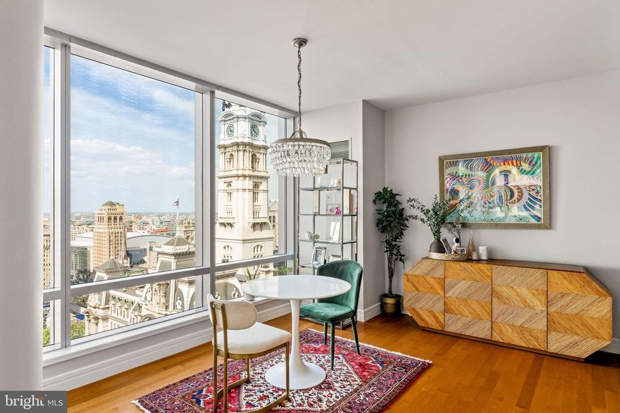 RITZ CARLTON Renovated corner 2 bedroom, 2.5 bath extraordinarily well maintained residence featuring 1645 square feet with some of the most incredible sunsets, skyline, and City Hall views you won't find anywhere else. In this renovated spacious residence, you have unobstructed views of City Hall, Two Liberty, the ever-evolving Philadelphia skyline, and gorgeous sunsets. This unit also includes custom built-in cabinetry with gas fireplace, floor to ceiling operable windows in every room (a unique feature in Center City), soaring ceilings, gorgeous new maple hardwood flooring throughout, a designer kitchen featuring Sefina cabinetry, leathered granite island, updated backsplash, Viking built-in gas cooking and microwave, Sub-Zero refrigerator, Miele dishwasher, Uline wine cooler, Dornbracht fixtures. The primary suite features incredible City Hall views from bed, custom built-in cabinetry to optimize storage, an en-suite with Calacatta marble floors and countertops, double vessel sinks, Bain ultra-soaking tub, Duravit commode, and a separate stall shower with a frameless glass enclosure. The Ritz-Carlton Residences is genuinely the finest white-glove building Philadelphia offers in Center City living. You will have access to a resident-only Mercedes make getting around town a delight. If you prefer walking, are mere steps to the best restaurants, shops, and parks. World-class amenities found at the Ritz-Carlton Residences Philadelphia include a state-of-the-art fitness facility overlooking City Hall & Dilworth Plaza, an indoor pool, spa, locker rooms, sauna, private Yoga room, and brand new Resident Lounge with brand new outdoor lounge/dining/kitchen and unbelievable theater room. This building is pet-friendly with a brand new on-site dog park.