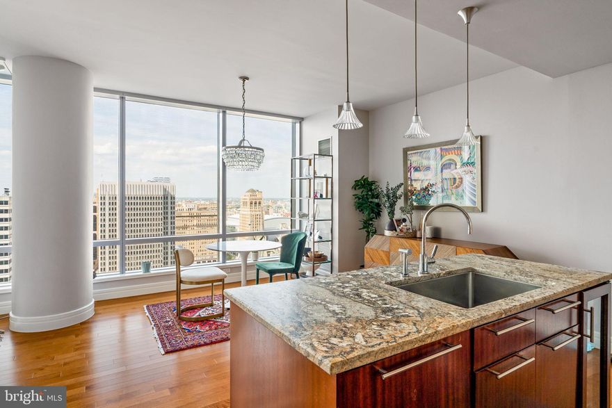 Renovated corner 2 bedroom, 2.5 bath extraordinarily well maintained residence featuring 1645 square feet with some of the most incredible sunsets, skyline, and City Hall views you won't find anywhere else. In this completely renovated spacious residence, you have unobstructed views of City Hall, Two Liberty, the ever-evolving Philadelphia skyline, and gorgeous sunsets. This unit also includes custom built-in cabinetry with fireplace, floor to ceiling operable windows in every room (a unique feature in Center City), soaring ceilings, gorgeous new maple hardwood flooring throughout, a designer kitchen featuring Sefina cabinetry, leathered granite island, updated backsplash, Viking built-in gas cooking and microwave, Sub-Zero refrigerator, Miele dishwasher, Uline wine cooler, Dornbracht fixtures. The primary suite features incredible City Hall views from bed, custom built-in cabinetry to optimize storage, an en-suite with Calacatta marble floors and countertops, double vessel sinks, Bain ultra-soaking tub, Duravit commode, and a separate stall shower with a frameless glass enclosure. The Ritz-Carlton Residences is genuinely the finest white-glove building Philadelphia offers in Center City living. You will have access to a resident-only Mercedes make getting around town a delight. If you prefer walking, are mere steps to the best restaurants, shops, and parks. World-class amenities found at the Ritz-Carlton Residences Philadelphia include a state-of-the-art fitness facility overlooking City Hall & Dilworth Plaza, an indoor pool, spa, locker rooms, sauna, private Yoga room, and brand new Resident Lounge with brand new outdoor lounge/dining/kitchen and unbelievable theater room. This building is pet-friendly with a brand new on-site dog park.
