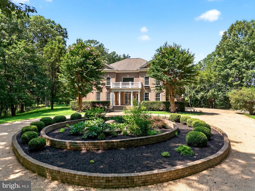 Fox Hill Manor 
Tucked within a peaceful private enclave in the heart of Virginia hunt country, 9565 Briar Lane is a classic brick estate that blends timeless architecture with modern comfort—all framed by uninterrupted views of the Blue Ridge Mountains. Surrounded by rolling farmland, thoughtfully designed gardens, and classic old boxwoods, this refined country home blends peaceful seclusion with timeless comfort and livability.
A columned front porch welcomes you through French doors into a grand foyer, where natural light fills the beautiful space. Immediately off the grand foyer, the formal living room sits to one side, featuring a fireplace and connecting seamlessly to a second, more casual living space with custom built ins. This relaxed gathering room opens onto the back deck and pool terrace, creating an ideal flow for indoor-outdoor entertaining. On the opposite side of the foyer, the formal dining room—adorned with elegant wallpaper and its own fireplace offers a sophisticated setting for entertaining.
The recently renovated kitchen offers panoramic views of the backyard and mountains beyond, complete with modern appliances, generous cabinet space, and abundant natural light. Adjacent is a custom mudroom with built-in bench seating and direct access to the two-car garage. A bar area and full bathroom complete the main level, while French doors throughout the home create seamless indoor-outdoor flow.
Upstairs, four generously sized bedrooms each offer private or semi-private porches, en-suite baths, and walk-in closets. The primary suite faces the mountains and features a covered porch, a spa-like bathroom with double vanities, a waterfall shower, a soaking tub, and an expansive walk-in closet. A full laundry room with washer and dryer is also located on the upper level for convenience.
The finished basement includes a fireplace and plenty of storage—perfect for hosting, recreation, or additional living space.

Grounds and Amenities
Outdoors, the home is surrounded by curated gardens, boxwood hedges, and thoughtful landscaping. A fenced backyard offers space for pets or play, while the rear deck and pool area provide a scenic backdrop for gatherings. Additional features include a pea gravel drive, a whole-house generator, and expansive views in every direction.
For the equestrian enthusiast or small-scale farming, the property includes a three-stall shed row barn, a large machine shed, and two additional storage sheds. The tennis court is privately tucked within the estate grounds.
This is a  rare opportunity to own a turn-key country estate with both charm and timelessness, ideally situated within minutes of Delaplane wineries, trailheads, and Piedmont Hunt Country.
Please note the tennis court and pool are being offered "As-is".