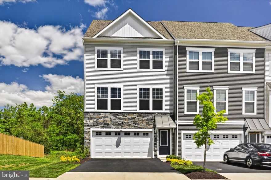 Welcome to this bright, southern light exposed end-unit townhome with a 2‑car garage in the highly sought‑after Arcola Town Center community. Built in 2024, this home features a modern, low‑maintenance design with an open floor plan and flexible living spaces to fit your lifestyle. The chef-inspired kitchen includes a large sit‑down island—perfect for cooking, gathering, and entertaining. Just outside your door, enjoy community amenities including a tot lot, neighborhood pool, and clubhouse. The newly opened Elaine Thompson Elementary School sits directly adjacent to the neighborhood for added convenience. Everyday shopping and dining are minutes away at Dulles Landing, home to Walmart, Dick’s Sporting Goods, Bed Bath & Beyond, HomeGoods, and more. Outdoor recreation is also close by with Hal and Bernie Hansen Regional Park and the Dulles South Recreation Center just a short drive away. This property is coming on the market 05/09/26 Saturday.