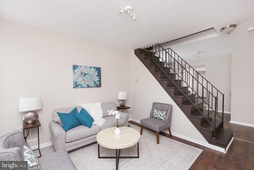 3 Bed, 1.5 Bath home in Pigtown with secure parking, a mudroom, and 2nd level laundry.  Exposed brick walls, central a/c, carbon monoxide detectors, and security system. Great location! Minutes from University of Maryland Medical Center, University of Maryland (Medical and Law School), Inner Harbor, Ravens Stadium & Camden Yards, 3 minute drive to 95 20 minutes to FT Meade and NSA.  Easy access to MARC train station.  |  LARGE LOT  14' X 65 |   This neighborhood qualifies for LNYW programs.