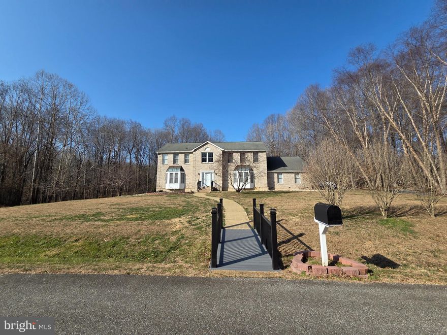 Nestled in the charming West End Farms community, this stunning Colonial home offers a perfect blend of comfort and style. Welcome to your private oasis on 3.81 acres, where serene views of trees and woods create a tranquil backdrop with Koi pond--fish not included--sorry!   With 4 spacious bedrooms and 3.5 bathrooms, this residence boasts almost 5,000 sq. ft. of living space, ideal for both relaxation and entertaining. The heart of the home features a beautifully designed updated kitchen equipped with stainless steel appliances, a pantry, and ample table space, seamlessly flowing into a cozy family room adorned with a warm brick fireplace. The interior showcases some modern updates, hardwood floors, and a traditional floor plan that enhances the sense of space. Enjoy the luxury of a soaking tub in the master bath and the convenience of a main-floor laundry. The fully finished basement, complete with a workshop and walkout access, offers endless possibilities for recreation or storage. S The expansive deck and patio are perfect for outdoor gatherings or quiet evenings under the stars. Located in a vibrant neighborhood, residents benefit from well-maintained parks, excellent schools, and convenient public services. The community fosters a welcoming atmosphere, making it easy to connect with neighbors and enjoy local events. With snow removal and common area maintenance included in the association fee, you can spend more time enjoying your beautiful home and surroundings. This property is not just a house; it's a place to create lasting memories.