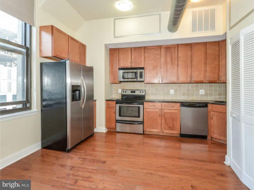 Located at the Marine Club Condos at 1100 S. Broad Street (Broad/Washington) we have a 1 bed, 1 bath  available now! The open living, dining and kitchen area boast shiny, hardwood floors throughout and impressive, high ceilings. Large windows allow for tons of natural sunlight; when desired. The kitchen is equipped with stainless steel gas stove, full size refrigerator, dishwasher, microwave and ample counter/cabinet space. The elevated, lofted bedroom area is large and freshly carpeted. The unit has central AC and also a ceiling fan in the bedroom. There is abundant closet/storage space. The bathroom is spacious, modern and stylish featuring nice tile work, a bathtub, and a separate shower. Tenants enjoy a huge, artfully landscaped courtyard perfect for relaxing, reading or entertaining.   For your convenience there is a washer/dryer installed in unit. Pets negotiable. Community features/amenities include: fitness center, 24/7 front desk in the grand lobby, gated access, parking available.  Unit layouts and finishes may vary*