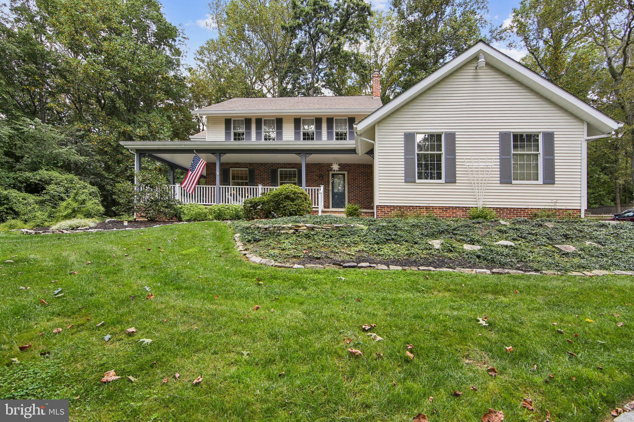 Welcome to this picture-perfect, well maintained, classic Colonial nestled on 1.4 acres in the scenic rolling hills of Chester Springs. Offering a wooded, private setting with gorgeous views of mature trees and landscapes, this custom-built home features over 2,640 sq. ft. of living space, four bedrooms, three baths, a two-car attached garage, a heated two car garage and a detached two car garage, and a full basement. Step inside and you’ll find an inviting foyer that leads to a bright, eat-in kitchen with a breakfast bar, spacious dining area, pantry closet, and sliding glass doors that open to the backyard. The formal living room is filled with natural light and flows into the dining room, where French doors lead to a covered patio perfect for indoor/outdoor entertaining. A cozy front porch offers the perfect spot to enjoy morning coffee and watch the sunrise. The spacious family room features a cozy brick fireplace and sliding door overlooking the backyard. This space offers a great place to entertain family and friends or just enjoy a quiet evening at home. A convenient first floor laundry room, with a private side entrance, adds to the home’s functionality. A powder room, and a spacious two car garage with custom shelving for storage, complete the first floor. Upstairs, the large owner’s suite includes a private bath, while the three additional bedrooms share a hall bath. One of the bedrooms has access to the third-floor unfinished space, which could be finished as an office, craft room, or simply used for extra storage. The full basement offers plenty of room for storage. The long private driveway leads to a second two car garage with additional parking. This heated two-car garage space offers endless possibilities including a workshop or hobby space for woodworking, auto restoration or storage, a private art studio, home gym or fitness studio, private office or so much more. This well- maintained home has a newer HVAC system, roof, and septic system giving peace of mind to the new owner. Located in the acclaimed Downingtown East School District, this gem comes with no HOA fees, multiple outdoor living and serene views of mature trees, creating a peaceful retreat! Located in sought-after Chester Springs, this home perfectly balances a private wooded setting with easy access to trendy restaurants, tons of shopping boutiques, and major business commuting routes including the PA Turnpike, Route 100, 401, and 30. Schedule a showing today!
