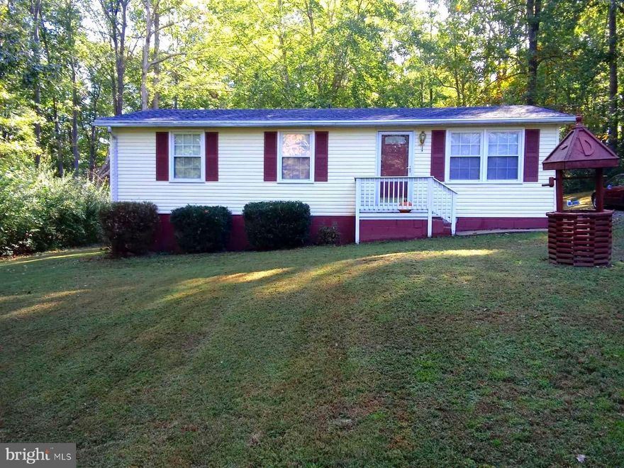 Over an acre of land with this adorable rambler! Open floor plan with family room off kitchen. Nice cabinetry with table space and laundry conveniently located off kitchen. New laminate flooring. Both bathrooms have been renovated. Gorgeous tile work in full bath and crown molding! Water heater and roof are newer and hvac replaced in 2007. Water treatment system. Deck on rear of home. Home warranty included for buyer! Private acreage, 2 sheds, as is condition. No HOA!