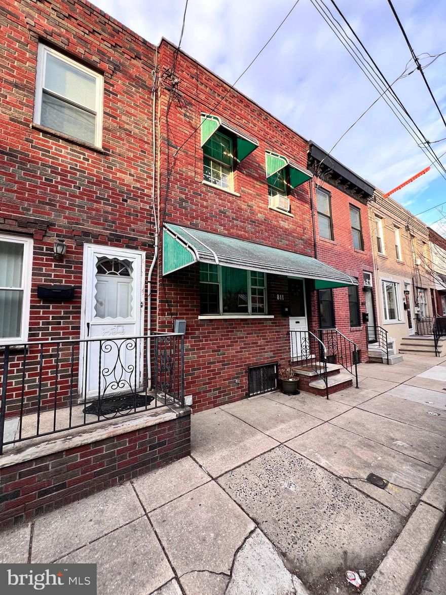 Welcome to 811 Pierce Street, a charming 3-bedroom, 1-bathroom rowhome nestled in the heart of South Philadelphia. This delightful residence offers 1,176 square feet of comfortable living space, featuring hardwood laminate floors throughout. The main level boasts a spacious living room, a separate dining area, and an eat-in kitchen, perfect for both everyday meals and entertaining guests. Upstairs, you'll find three generously sized bedrooms, each providing ample closet space, and a modern, well-appointed bathroom. The full basement offers additional storage or could be easily finished for a potential home office or recreation area with separate laundry area. Outside, a cozy yard provides a private retreat for relaxation or gardening. This home combines classic architectural details with modern updates. Conveniently located near the vibrant East Passyunk Avenue and the Italian Market, you'll enjoy easy access to a variety of shops, restaurants, and public transportation options. Don't miss the opportunity to make this well-maintained property your new home.