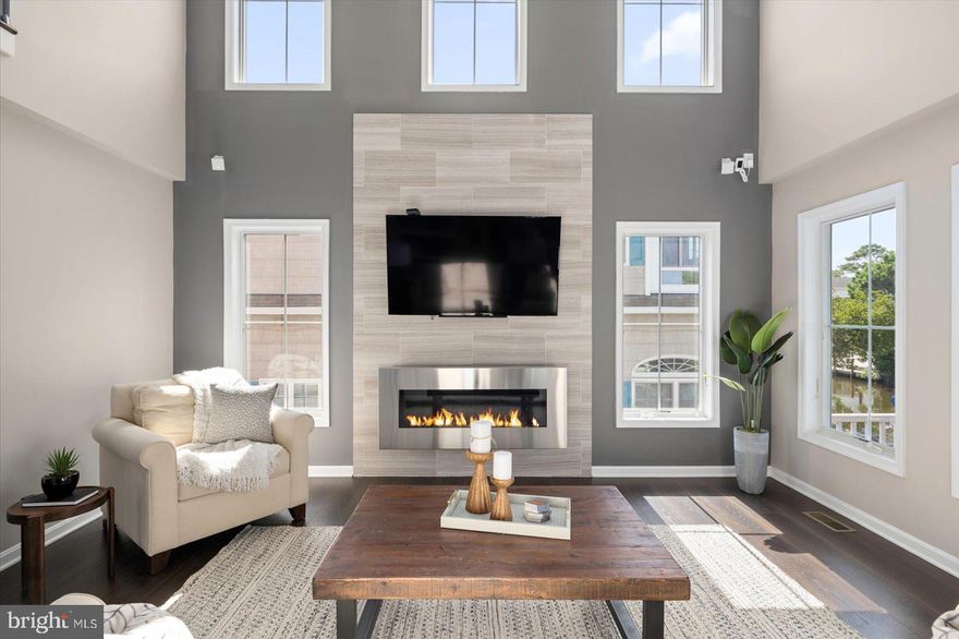 Waterfront elegance is here and awaits the consummate buyer that appreciates style and elegance blended with coastal beach and bay lifestyle.  This amazing designer decorated house (featuring a brand new paint color)  is the total package with unlimited choices - walk to the private beaches of South Bethany or jump on your boat and jet skis for a fun day on the water (with the ease of boat lifts).  The interior of the home demonstrates open concept, perfect for family gatherings and each space will be sure to wow you  - starting with hardwood throughout, top level finishes, elevator, beautiful decor, cozy fireplace and overall luxury any owner would desire.   Sold fully furnished and turnkey ready.   You have to see to believe!