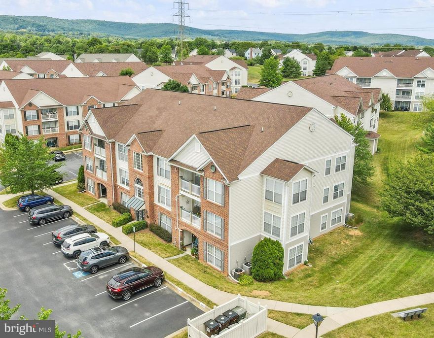 Take a look at this spacious 2 bedroom, 2 full bath condo in the sought after community of Whittier.  CONDO FEES PAID THROUGH END OF2024 WITH Acceptable offer! This beauty has 1385 SF of living space. Open floor plan with a separate, private door entrance from the patio. NO CARPET, OR STAIRS.  Newer wood floors, new quartz countertops, new backsplash, and microwave. Large bedrooms, with the primary having its own ensuite bath and walk in closet. Park right outside your door with plenty of overflow parking for your guests nearby. Enjoy all the perks this  community has to offer! Mountain views, Whittier lake,  3 pools, soccer field, tennis, basketball, and the list goes on. Whittier elementary school is inside the community. Shopping center by the lake with restaurants, gym etc. Close to Fort Detrick. Minutes to I-15.