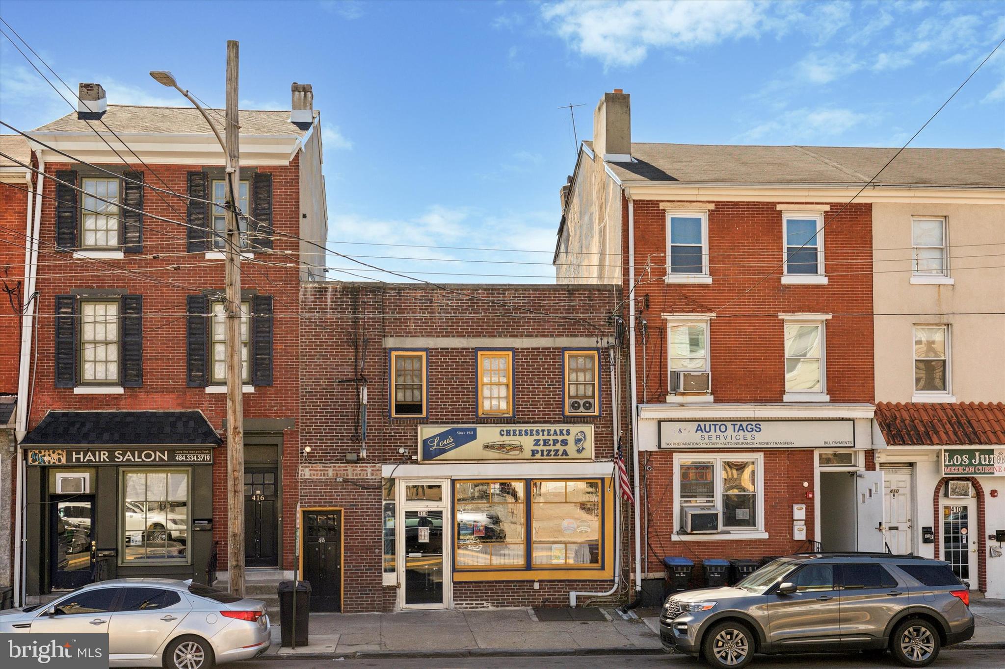 Don’t miss the chance to own one of Norristown's most sought-after locations 414 E. Main St. only 2 blocks from Montgomery County's $415,000,000 Justice Center that is still currently under construction slated for an end of 2026 completion! 414 E. Main St. which has been the home of Lou's Steak Shop for the last 83 years, where generation's of the Alba family have served the most delicious Cheese Steaks and Italian Zep's to the public. Situated on the bustling E. Main Street in Norristown, Pa. directly across from the historic Holy Savior Parish, this property offers unmatched visibility.
Property Highlights: The restaurant holds 44 occupants, has 21 off street parking spaces, a rear hidden kitchen area, large basement storage area, 2 1 bedroom 2nd floor residential apartments that are collecting $1,450.00 per month, both Leases are month to month. There are 3 additional parcels included with the sale of 414 E. Main St. 441 E., 443 E. Main St., 441 E. Lafayette St., 443 E. Lafayette St. (all parking areas). Norristown is on the move with property values on the rise. Never has so much development been present in Norristown since it's last growth spurt which dates back to 1853! Combined with the above-mentioned Justice Center there are multiple new residential Construction projects as well, currently under construction with hundreds of new homes on the way. Be a part of Norristown's growth while you still can!
Contact us today to schedule a showing and explore the potential this property holds for you!
PLEASE NOTE LOU'S STEAK SHOP AND ALL IT'S EQUIPMENT AND FURNITURE ARE NOT INCLUDED WITH THE SALE PRICE AND IS BEING SOLD SEPERATELY. THE PROPERTY IS ONLY AVAILABLE WITH A SUCCESSFUL PURCHASE OF THE LOU'S STEAK SHOP BUSINESS. AGENT WILL DIRECT ANY PROSPECTIVE BUYER TO THE BUSINESS OWNERS' REPRESENTATIVE.