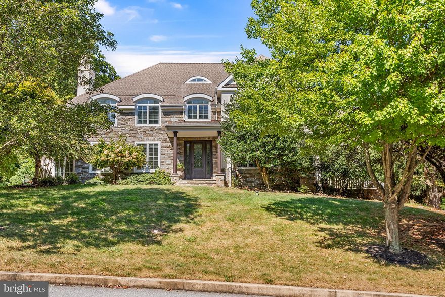 Welcome to 353 Arbor Circle in Media! Situated on a cul-de-sac with other gorgeous homes, 353 Arbor has a neighbor on just one side as the other side and back neighbor Tyler Arboretum and Ridley Creek Park. This provides amazing forest views, easy access to hiking trails, as well as privacy. With nearly 7000 square feet of living space including a large, finished basement, this home has plenty of space for all your needs. Whether you work from home, require in-law quarters, or just want more space, this gorgeous home has you covered. As you enter through the main door into the foyer, you’ll see a formal living room to your left, complete with fireplace and two large windows to allow plenty of light into the space. Straight ahead you’ll see a wide hallway and the main stairs to the second level. To the right is the large, freshly-painted dining room. French doors from this space will take you to the patio on the side of the house. Foliage offers natural privacy for this space. Back inside and through the dining room towards the kitchen you’ll first entry a butler’s pantry area. Offering a wet bar, cabinetry, a wine fridge, and large walk-in pantry closet for storage, this space adds functionality to your kitchen. Continue into the kitchen and you’ll find some seating at the large island as well as a bright and inviting breakfast nook. Back into the hall from the kitchen, behind the main staircase, you’ll find a mudroom space that leads to the oversized three-car garage. Back by the main entrance to the left of the stairs you’ll find a formal powder room in the hall that is just outside a very large main-level office off the driveway. There is also a door leading to the elevator which goes from the basement all the way to the attic. Back through the kitchen to the right and down the hall you’ll find a family room with built-ins for any entertainment needs, a natural gas fireplace, and plenty of room for a large sectional. There is also a powder room and a second smaller office in this part of the house. The back staircase there takes you down to the basement level or up to the bedrooms. In the basement, you’ll find a bar area, a tv area, and a space large enough for table-tennis or a pool table. There is also a large unfinished space which is perfect for storage. And don’t miss the gym! Go through the unfinished space to the home gym. Taking that back stairway all the way up to the second floor, you’ll find a bedroom with it’s own full bath. On this side of the house you’ll also find the convenient, second-floor laundry room. Continue down the hall to bedroom number two which shares a Jack-and-Jill full bath with bedroom three. Finally, you’ll enter the main bedroom suite. First you’ll find a small nook that could be a seating area or could be home to a dresser. Continue through to the main bathroom with oversized, walk-in shower, separate tub, and two sinks. You’ll also find a huge walk-in closet with enough custom built-in drawers and shelving to house any wardrobe. Finally, through this closet space is a space that could be a fifth bedroom or an in-law suite. This space is above the three-car garage and shares the same footprint. So it is BIG. It already has it’s own full bath and a stairway with separate entrance directly to the driveway. If the new owners added a small kitchenette, this could be a fully-functional in-law suite. This space also has a window nearly the size of the entire back wall offering gorgeous views into the yard and forest beyond. A sprinkler system keeps the beautiful plantings fresh. The fenced-in backyard has a second patio space for your grill and outdoor furniture. Located in Middletown Township and the award-winning Rose Tree Media school district, you’ll find that Penncrest High School is about a two-minute drive. It’s also just a couple minutes from Ridley Creek Park, Rts 252 and 352 and 1. Make your appointment today!