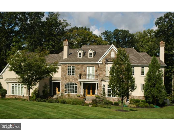 First class finishes throughout this spectacular home! Amazing millwork in every room including coffered ceilings, heavy crown molding, wainscoting and decorative columns. Gorgeous Brazilian cherry floors, floating staircases with wrought iron rails, custom light fixtures, open Kitchen with granite counters, center island and prep sink, pot filler and high-end appliances. Hearth Room with stone wall, custom built-ins, gas fireplace, Breakfast Rm with walls of windows, step-down Gathering Room with fireplace, doors out to terrace, 1st floor Study. Homework loft with custom built-in work station,en-suite bedrooms, Main Bedroom with gas fireplace, dressing room,and mother's retreat. Main Bath with dome ceiling,radiant heat, walk-in shower and river rock accents. Finished Lower Level with Theater Room, full Bath, custom bar and living area. Finished attic offers bonus space. Beautiful balconies,recessed closets with custom organizers, 3 acre lot on private cul de sac and New Hope Solebury schools. One of a kind!
