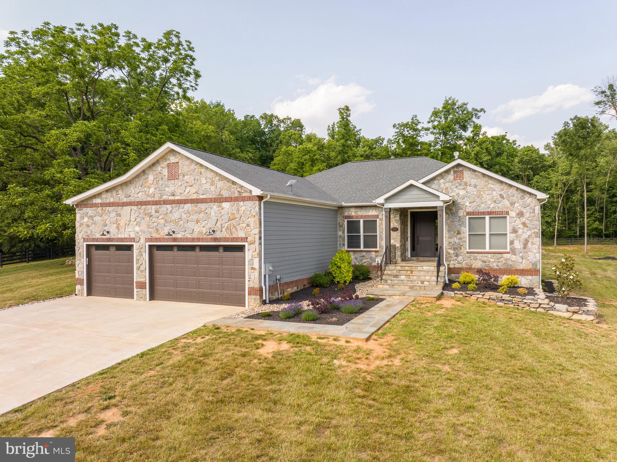 This masterful design will captivate you the moment you arrive at this 2019 custom-built ranch style home. Situated on over 3 acres in this highly sought after gated Potomac River community, this exquisite home offers 3 bedrooms, 3.5 baths with a home office. Enjoy this spacious open floor plan featuring gorgeous hardwood floors, upgraded craftsman styled interior trim and 9ft ceilings with a beautiful stone LP fireplace. The gourmet kitchen boasts top end Kitchen Aid appliances, upgraded cabinetry and quartz countertops , including a glass cooktop and tandem wall oven/microwave. Enjoy gathering and entertaining around this large island that has a double bowl sink featuring a reverse osmosis system . The owner's suite features two walk-in closets and a deluxe owner's bath with double bowl sinks, beautiful marble countertops, and a spacious super shower with floor to ceiling ceramic tile and decorative listello. The two impressive guest suites each feature large walk-in closets and full baths. The main level offers over 2,300 finished square foot, but you also have 2,300 unfinished square feet in the basement to make your own! The walk out basement has neatly placed rough-ins to allow for maximized space for framing your future living space including full bathroom rough ins. The basement utilities feature a HE dual LP/electric furnace, top of the line whole house water softener and reverse osmosis system with UV light, pressure regulator, 80gal water heater with heat pump and whole house Kholer generator. This remarkable home's exceptional attention to detail in every room makes this home the only one you will want to see! You will enjoy entertaining guest on your back covered porch that leads to a flagstone patio with a fire pit. The 30x40 detached garage built just this year offers space for 4 additional vehicles or use to store your boat and other equipment. The community offers a private marina that provides access to 8 miles of boatable waters. This stunning home has it all!