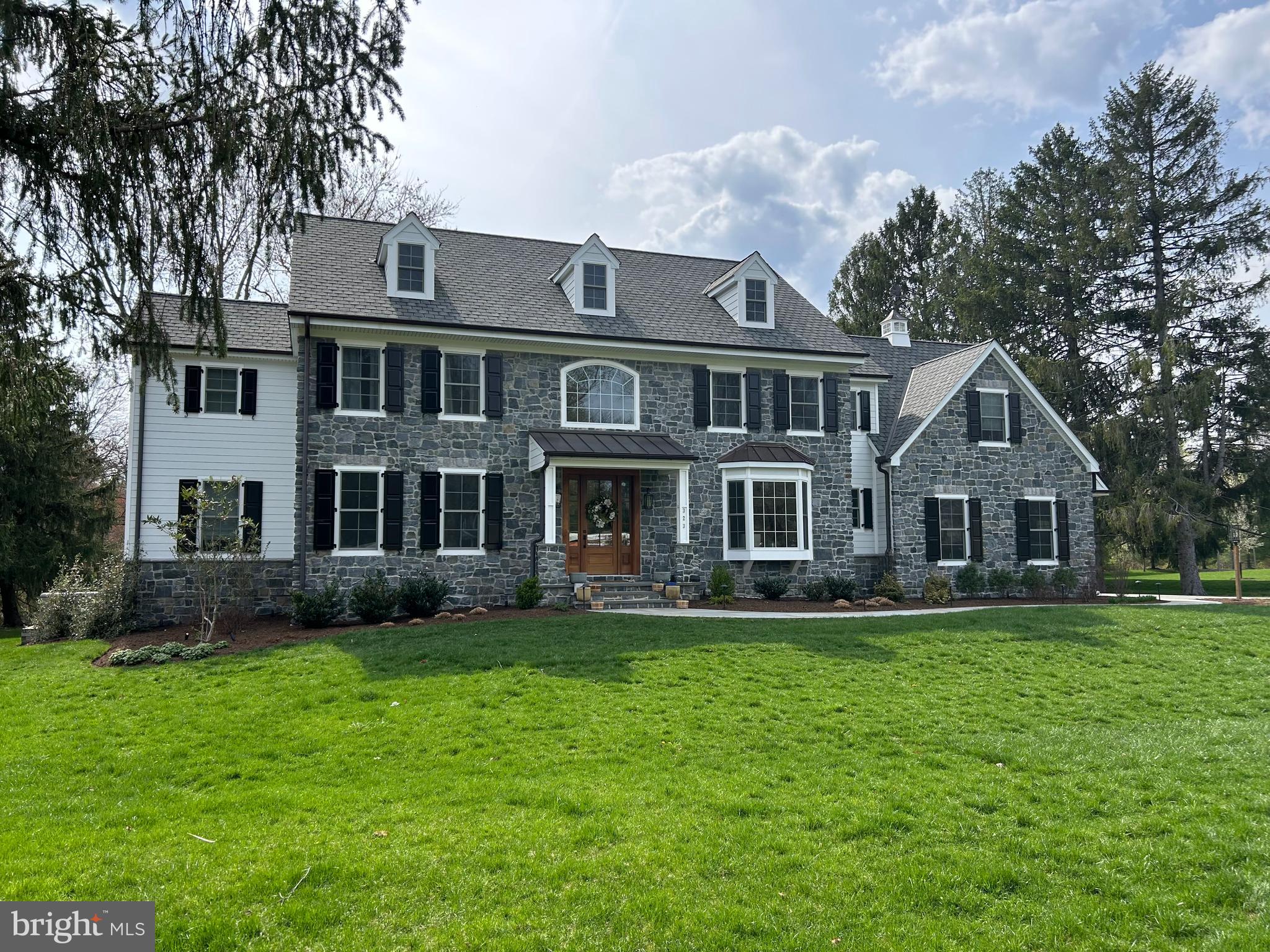 New home to be built by R Custom Homes on a beautiful, level, 1 acre lot in a terrific Willistown location just minutes from Malvern Borough. This home offers five bedrooms and three and a half bathrooms, a three-car garage and a basement with an egress window or walk-up (depending upon the grade). This classic center hall colonial design by Hoffman Architects features the open and flowing floor plan desired by today’s buyers. Standard luxury features include 9ft ceilings on the first floor, extensive millwork throughout, lots of hardwood floors on the first floor, sun-drenched family room with gas fireplace, gourmet kitchen with stainless steel appliances, center island, quartz countertops, breakfast area, large main floor laundry room and two separate HVAC systems – just to name a few! This design also features a formal dining room with coffered ceiling, a comfortable family room just off the kitchen, and the ever-important private study/home office on the first floor. The exterior features stone and low-maintenance Hardie Plank siding, some standing seam metal roof, classic shutters and a covered front entry. Located in desirable Great Valley School District and with easy access to local shops, restaurants and public transportation, this home is a great opportunity! Please note: Home pictured is not the actual home - it is a home built previously by R Custom Homes that is the exact floor plan that is to be built at 17 Hickory. Photos may show options that are not included in the list price. Currently, builder is flexible with minor alterations to interior space.